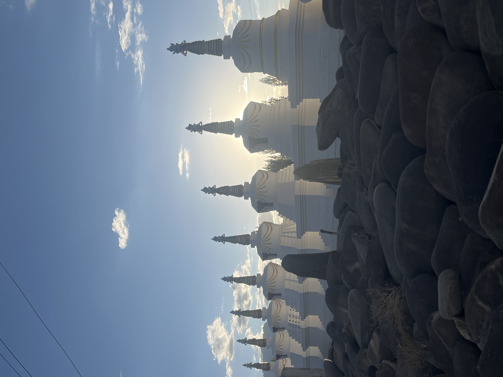 White stupas catch sunlight at Thiksey monastery, Ladakh