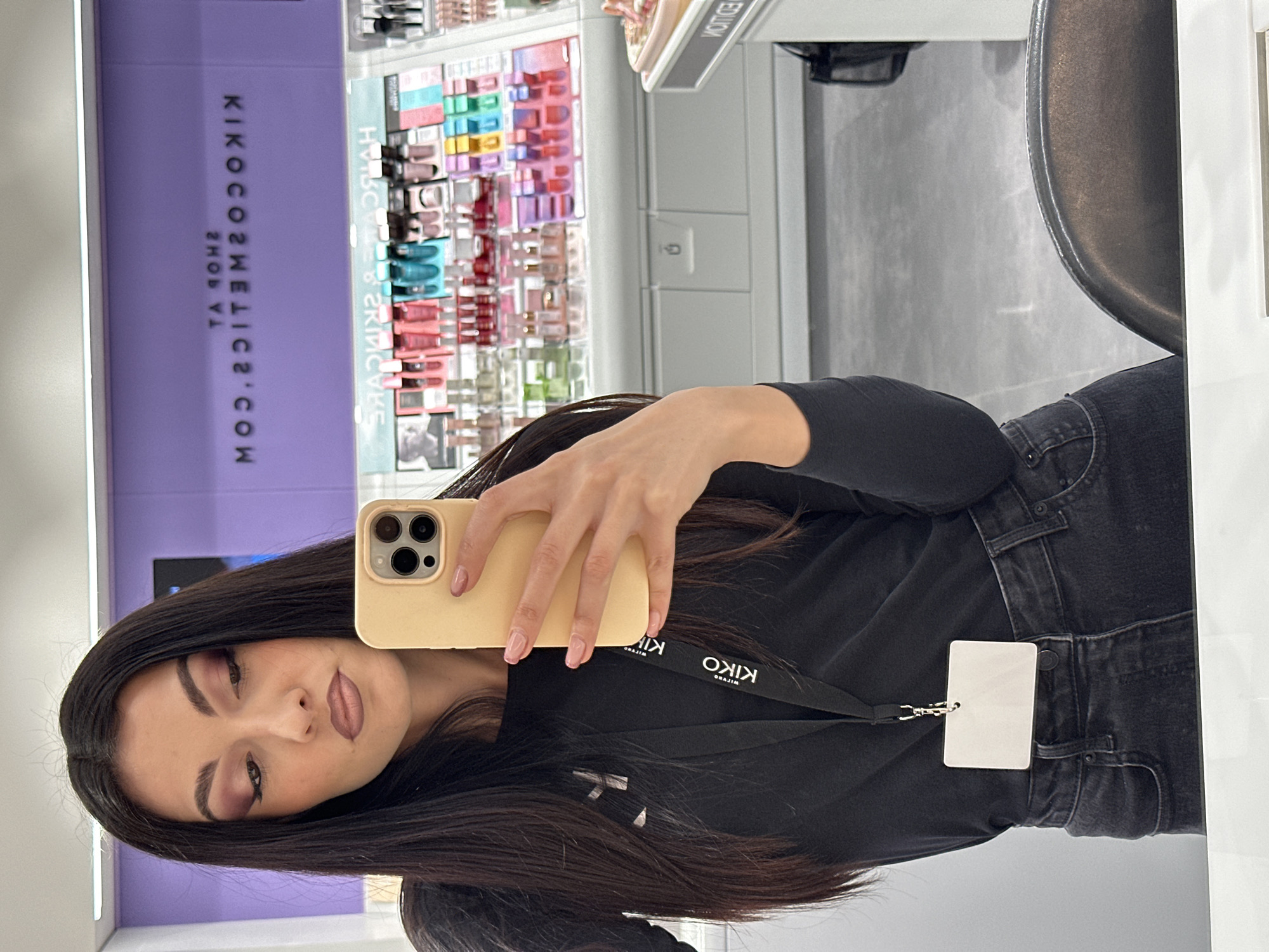 Woman Takes Mirror Selfies in Cosmetics Store