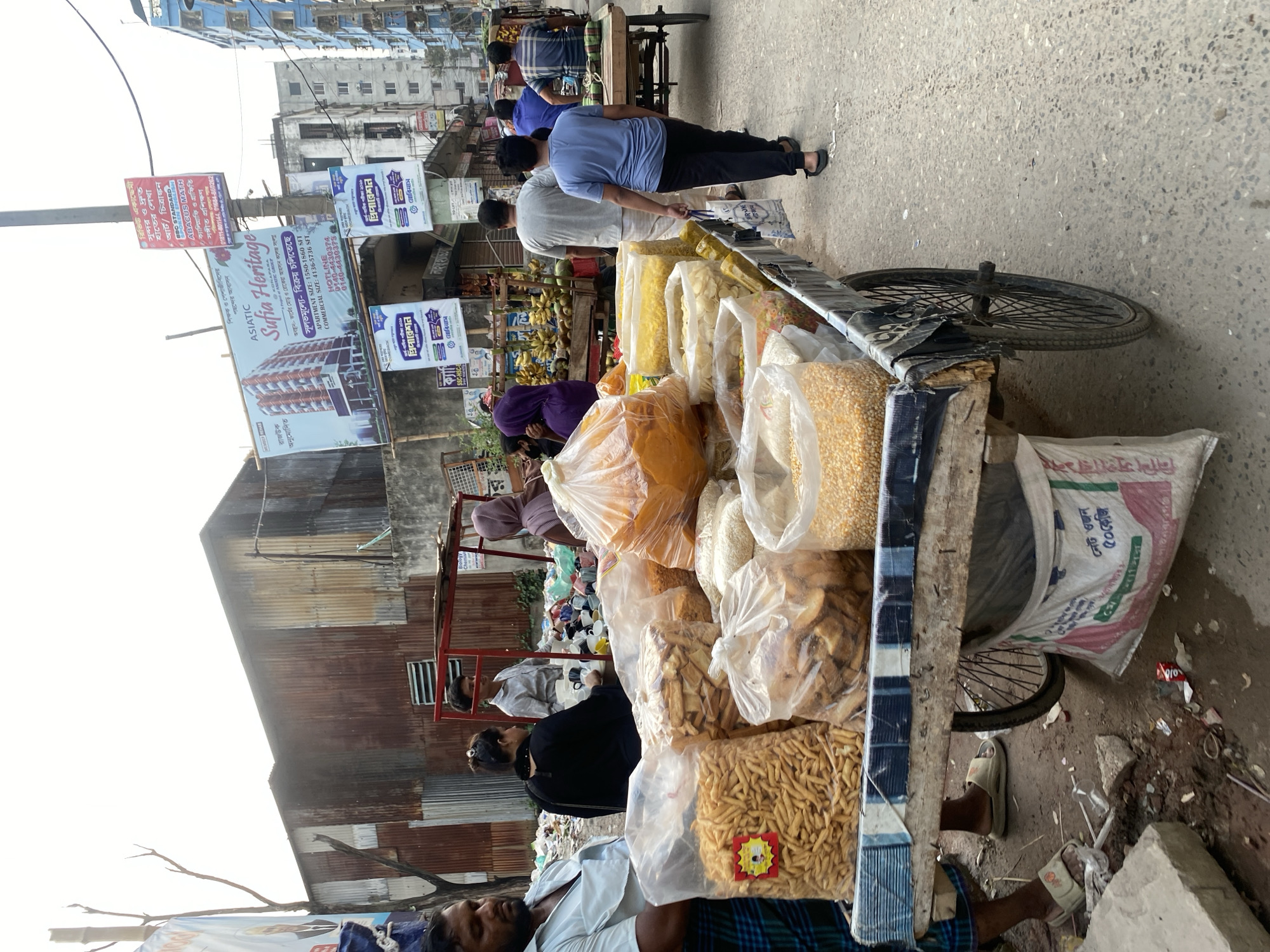 Everyday street life documented across Dhaka neighborhoods Saturday morning