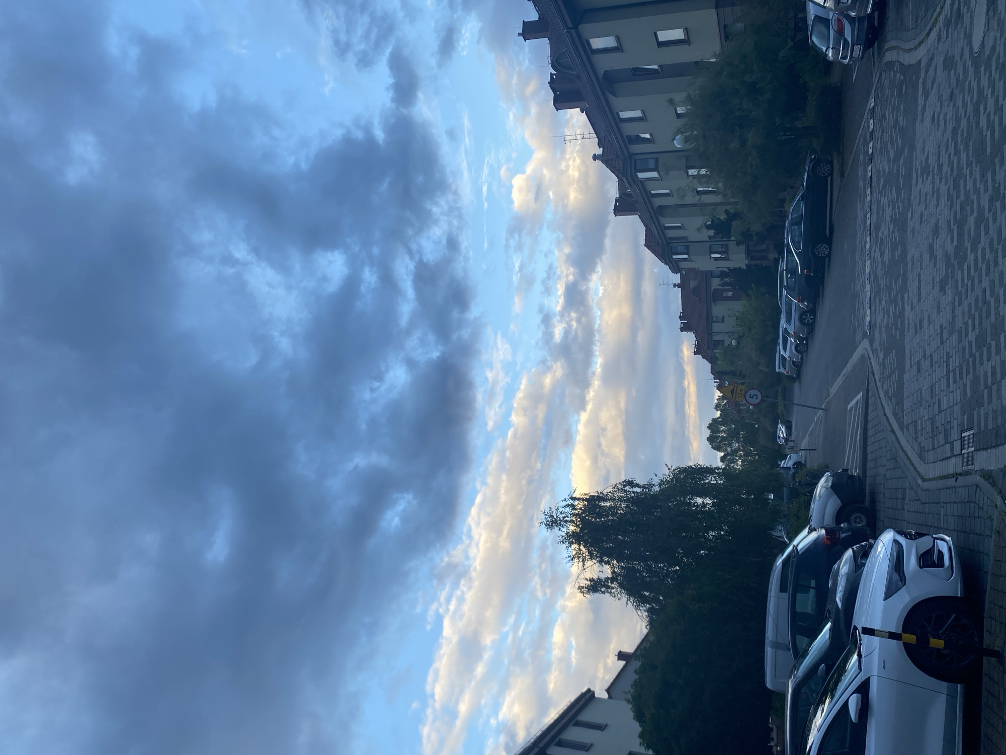 Storm clouds gathering over Wrocław residential streets
