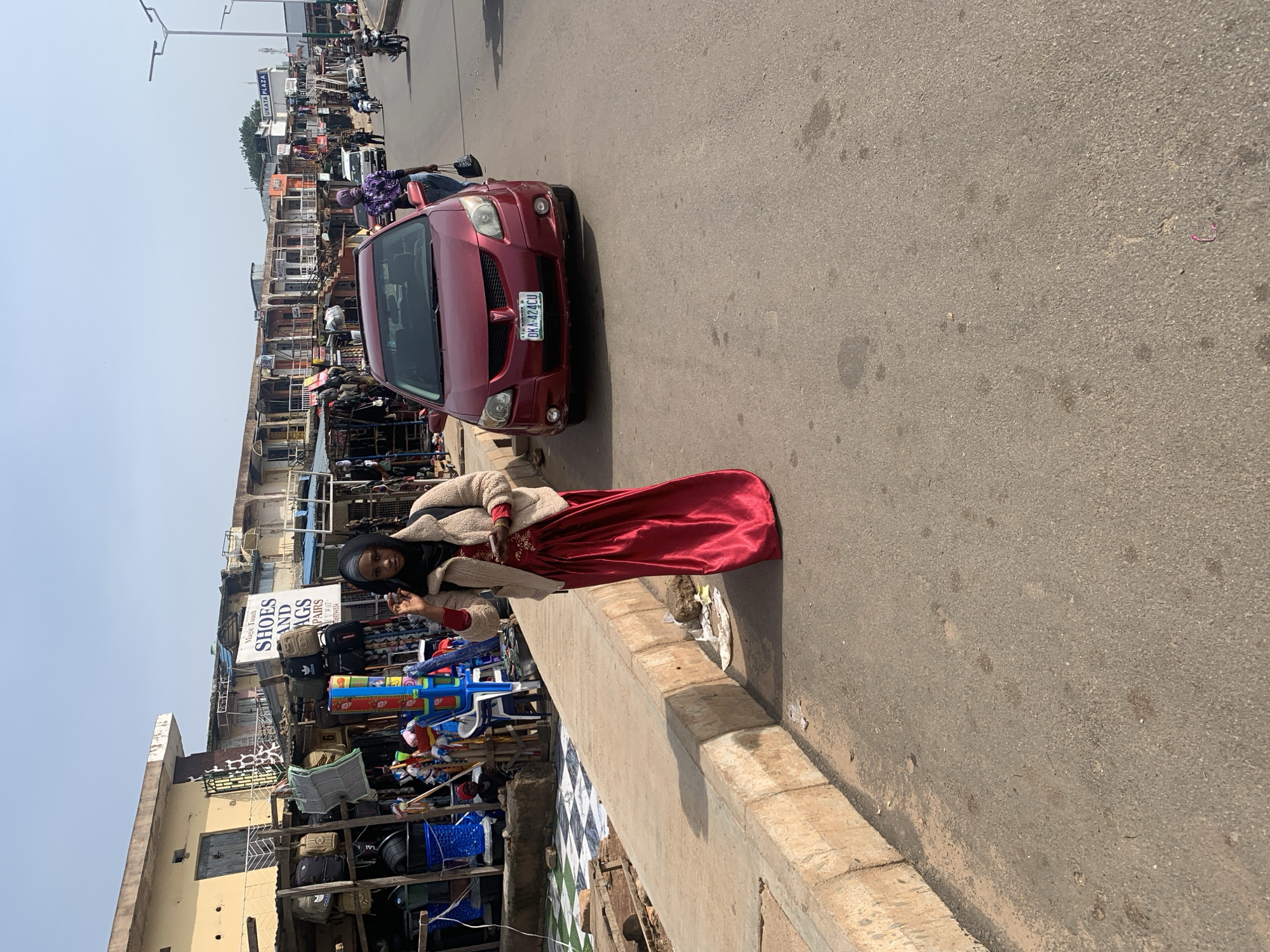 Morning street life and market activity in Jos, Nigeria