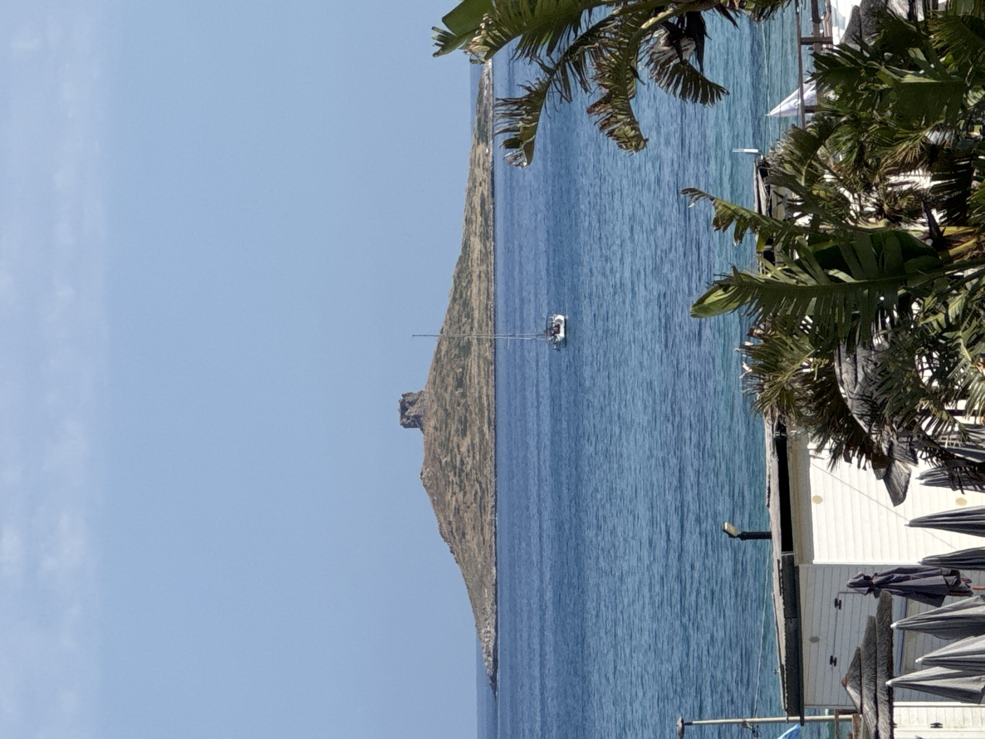 Resort workers maintain Sicilian coastal properties during morning hours