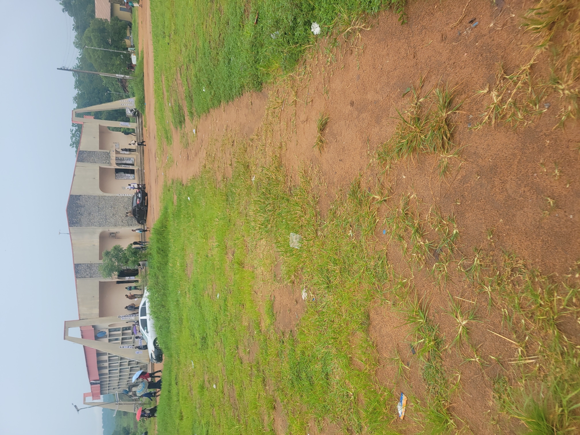 Morning activity around a Nigerian institutional campus with banks and ICT centre