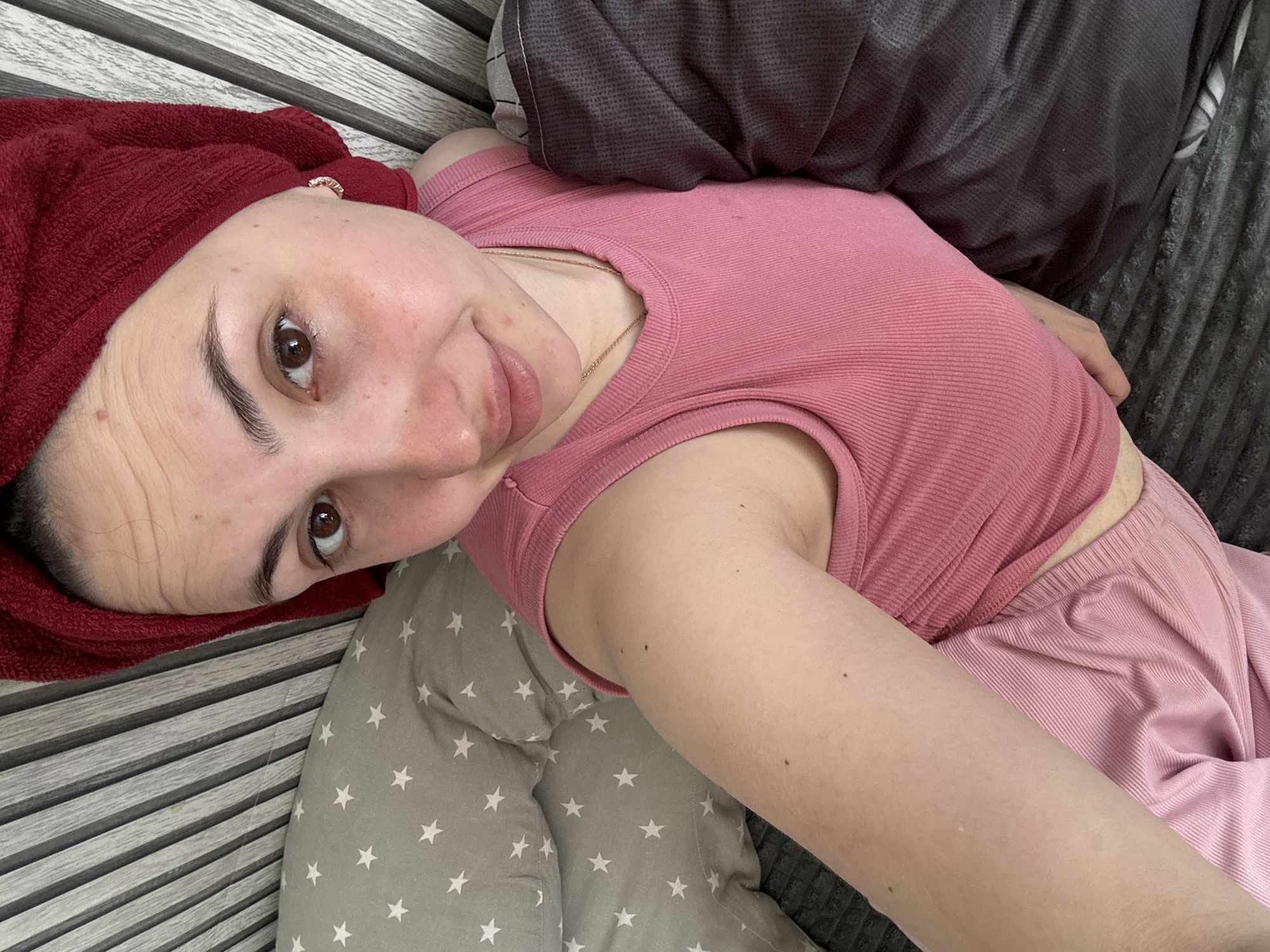 Woman rests with towel-wrapped head in Марковский room