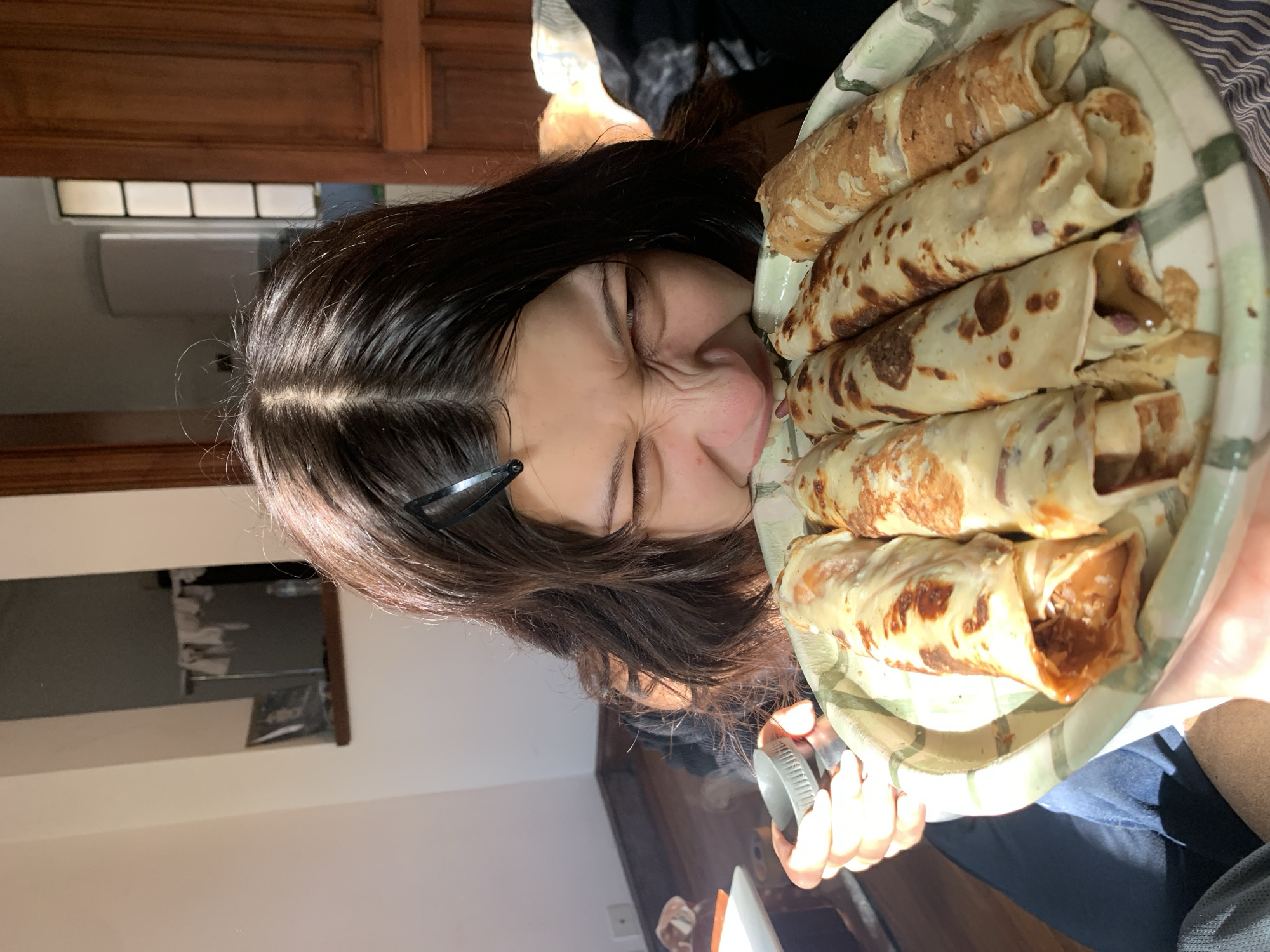 Young person enjoys crepes in Buenos Aires