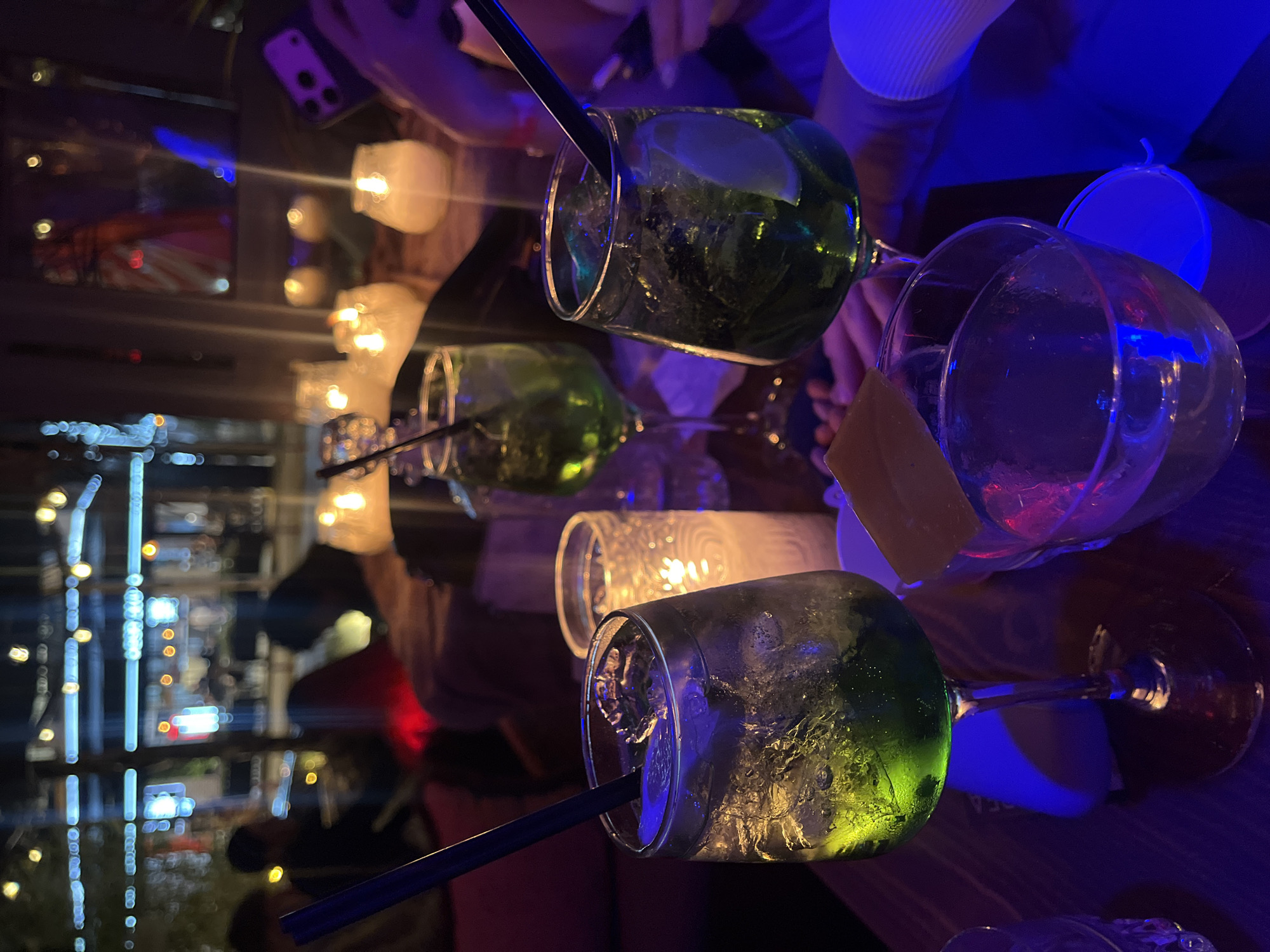 Evening social gathering at cave-themed bar in Kassandra, Greece