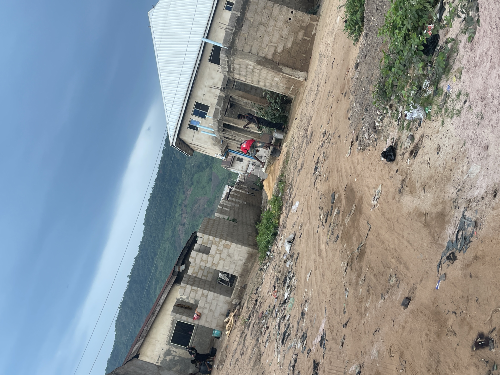 Street life and commerce across Lokoja's dusty, developing neighborhoods