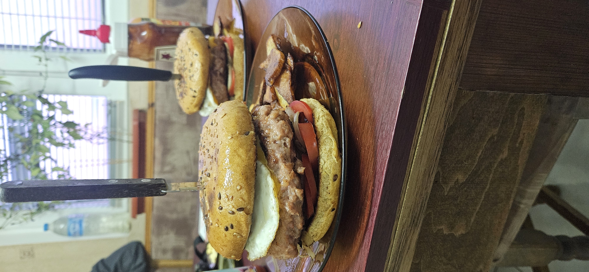 Restaurant meal served with knives through sandwiches in Sofia