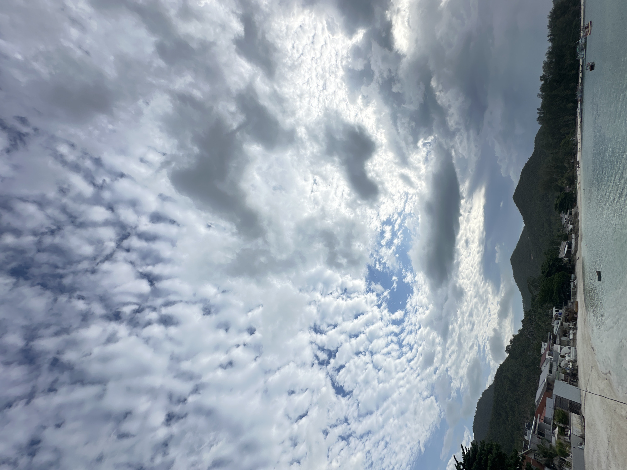 Morning life unfolds on Ko Phangan's dramatic coastline