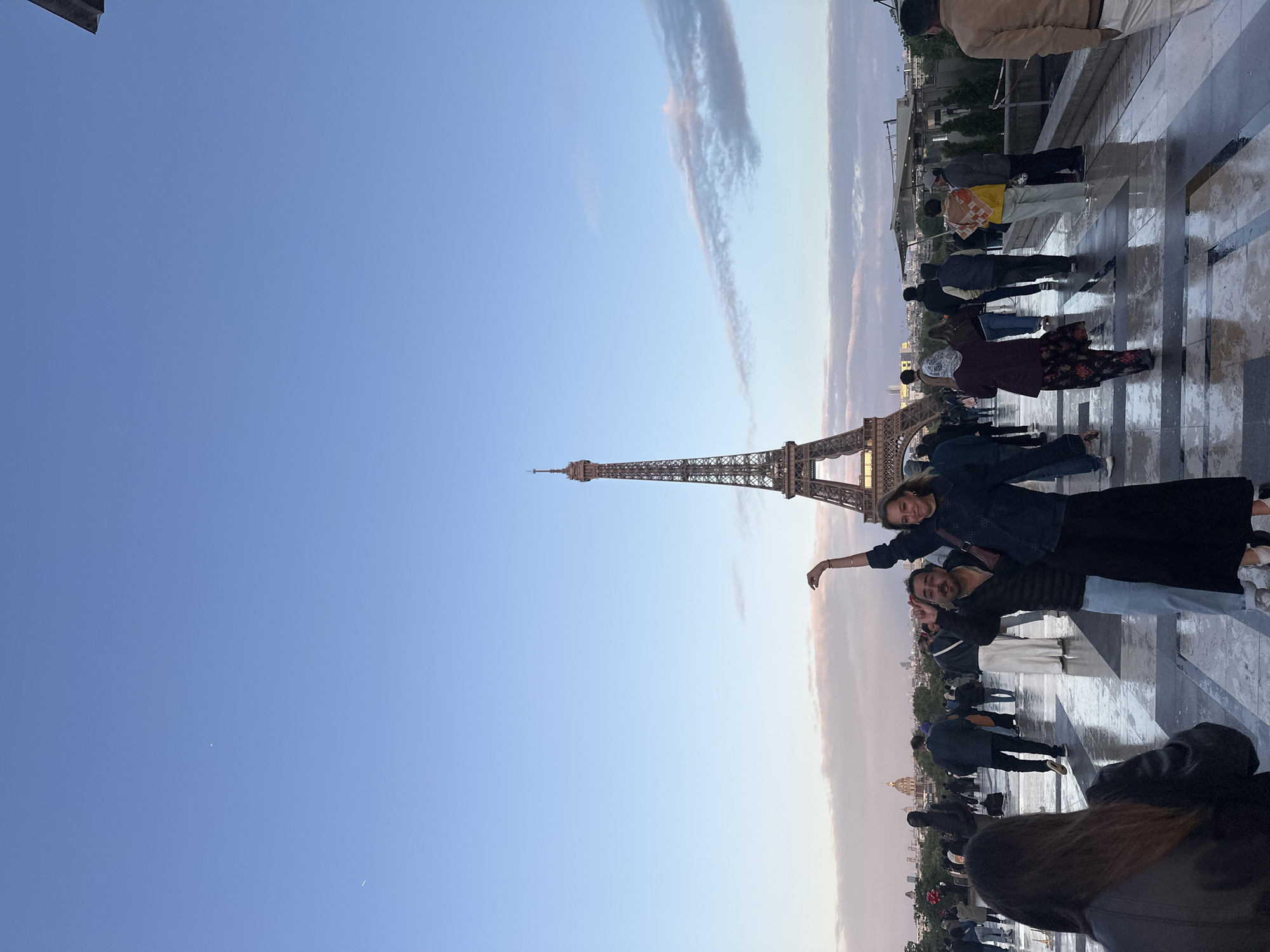 Tourists gather for photos at Eiffel Tower in Paris