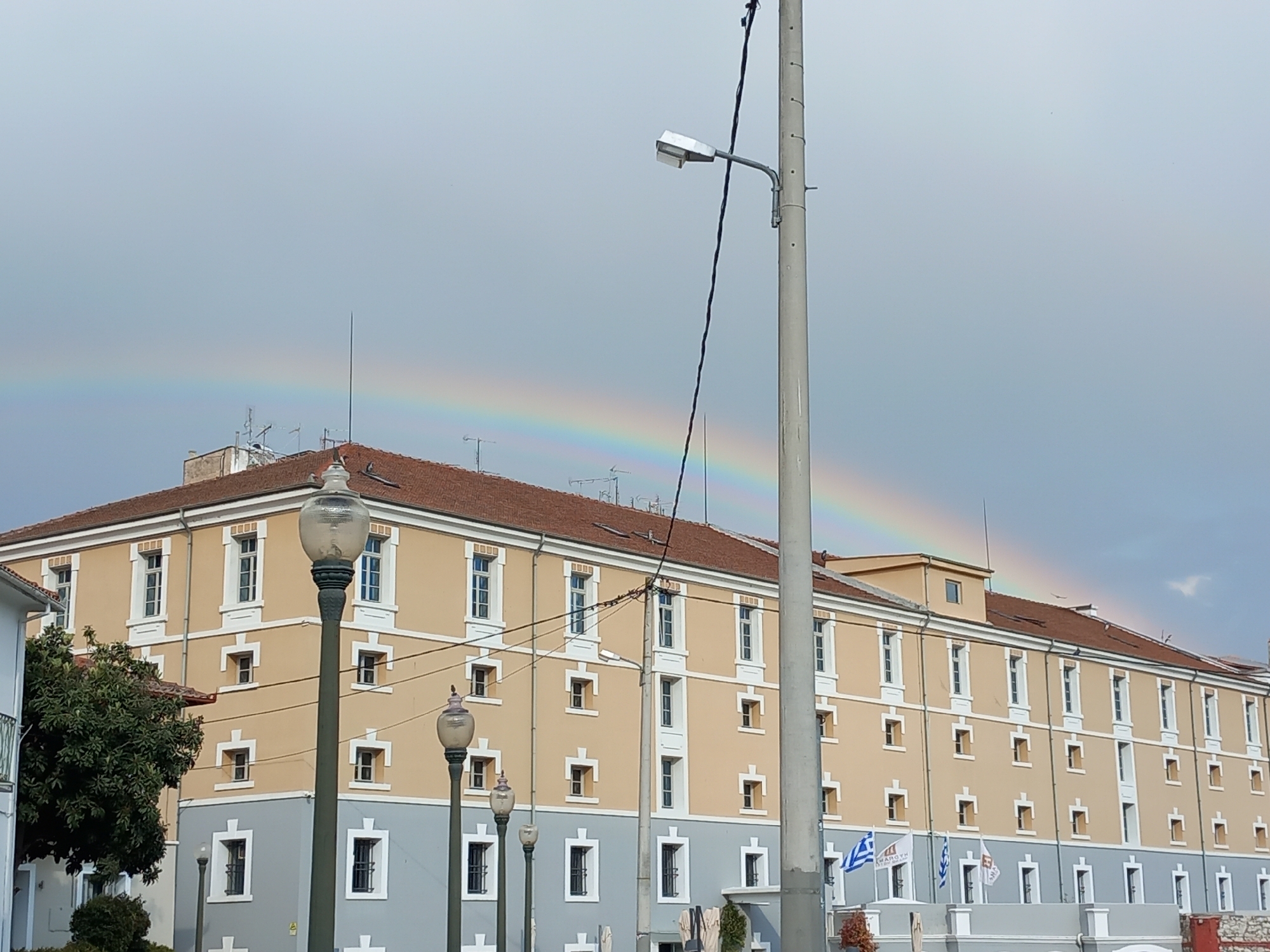 Rainbow appears over Drama, Greece as swans gather in park