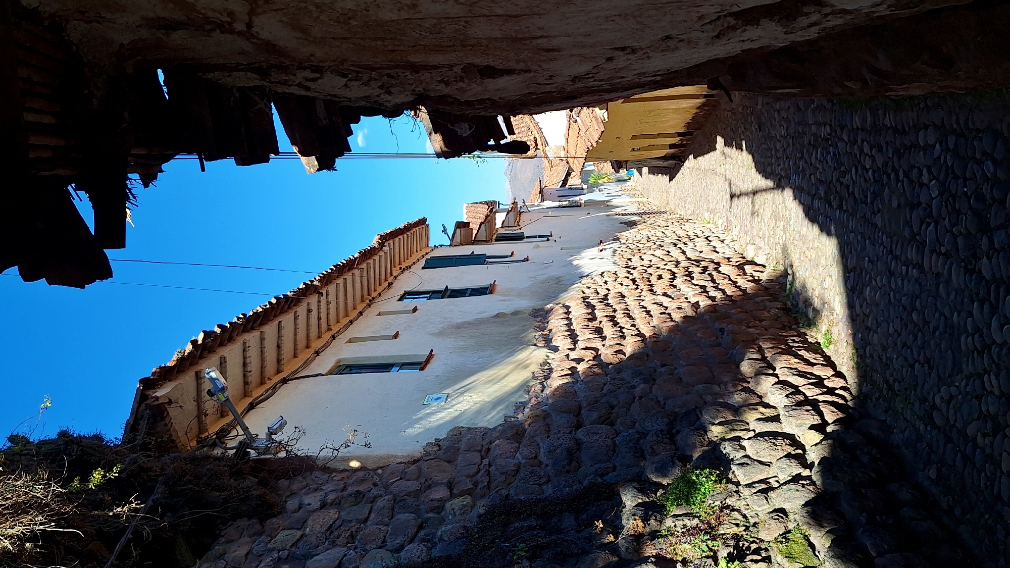 Up and down a cobblestone alley in Cuzco