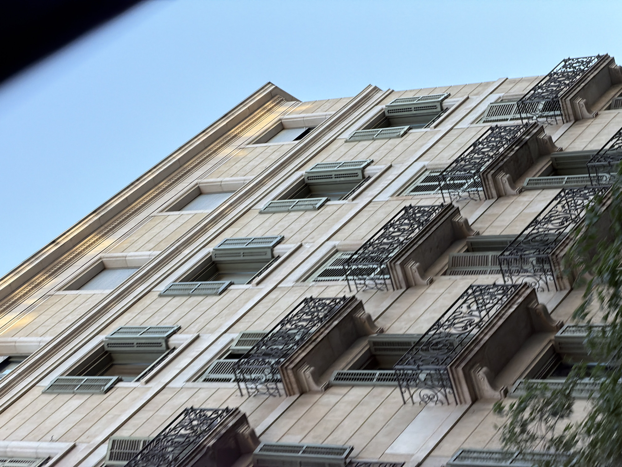 Casa Batlló's facade up close, golden hour on Passeig de Gràcia