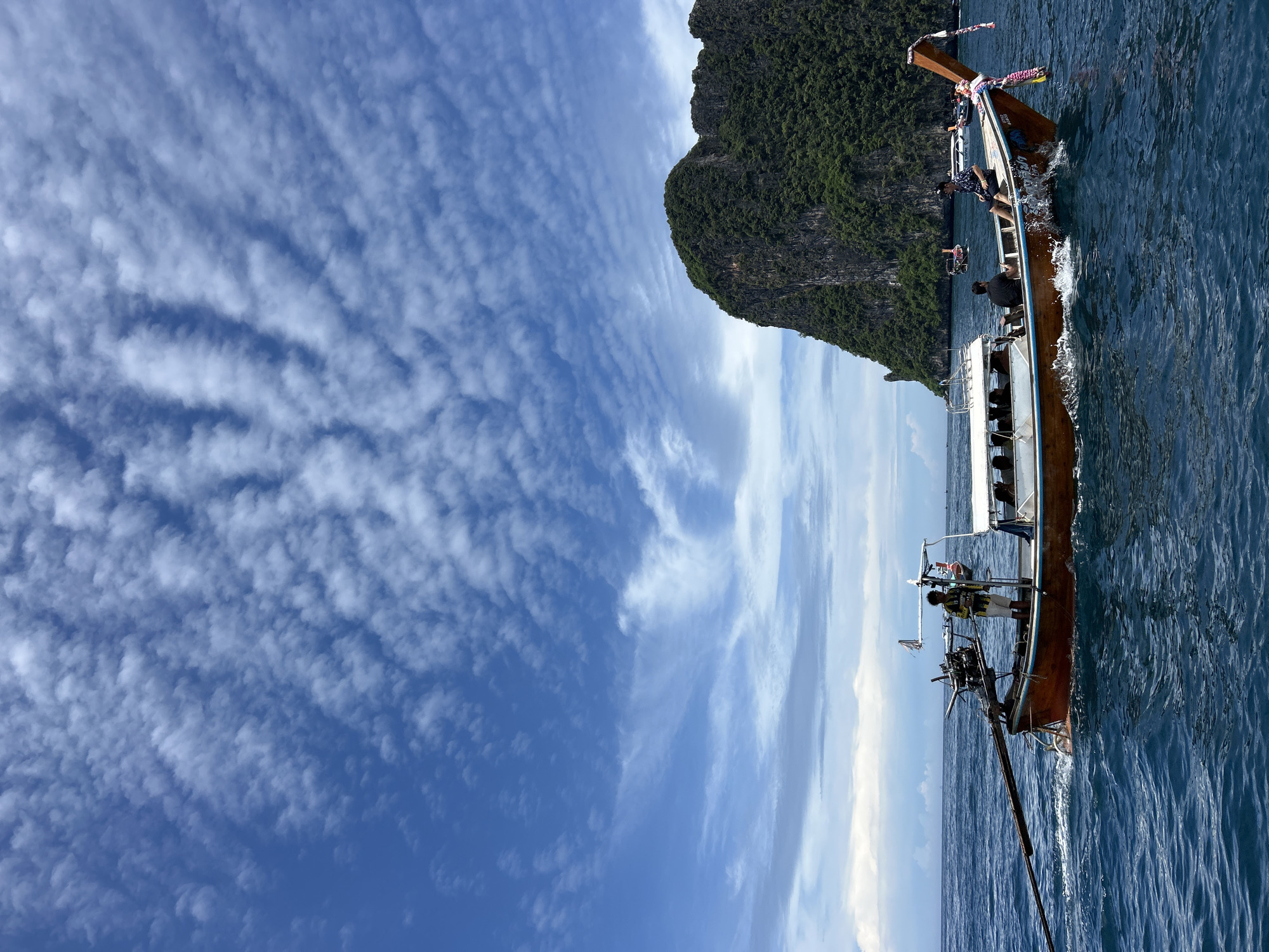 Longtail boat carries passengers through Ao Nang waters