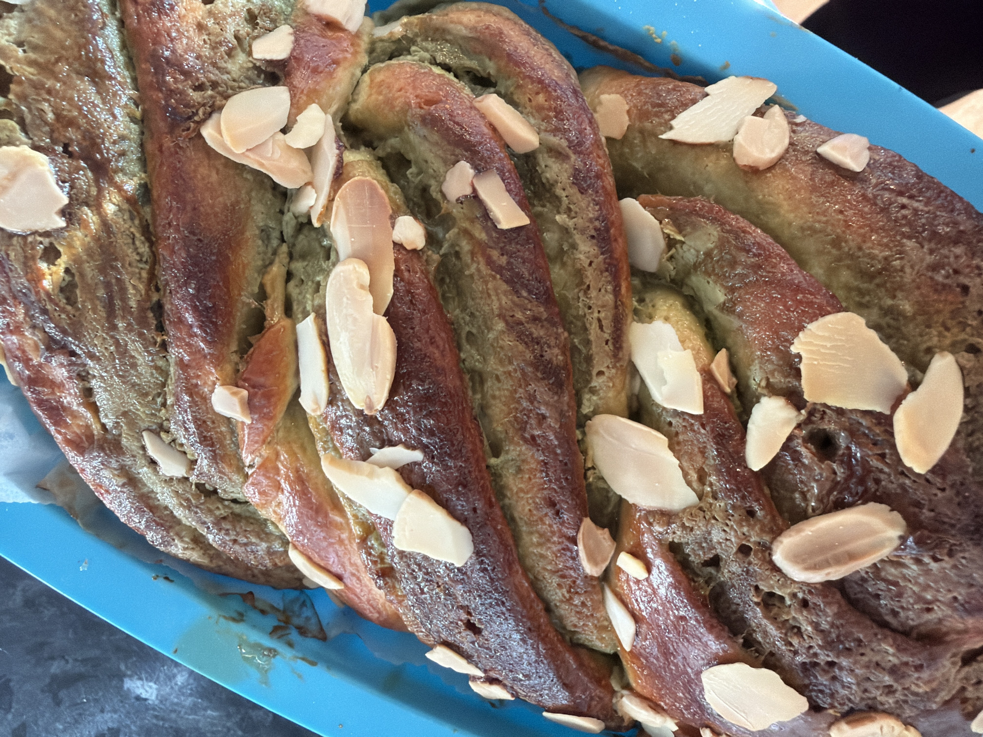 Green-tinged braided bread with almonds baked in Bretton