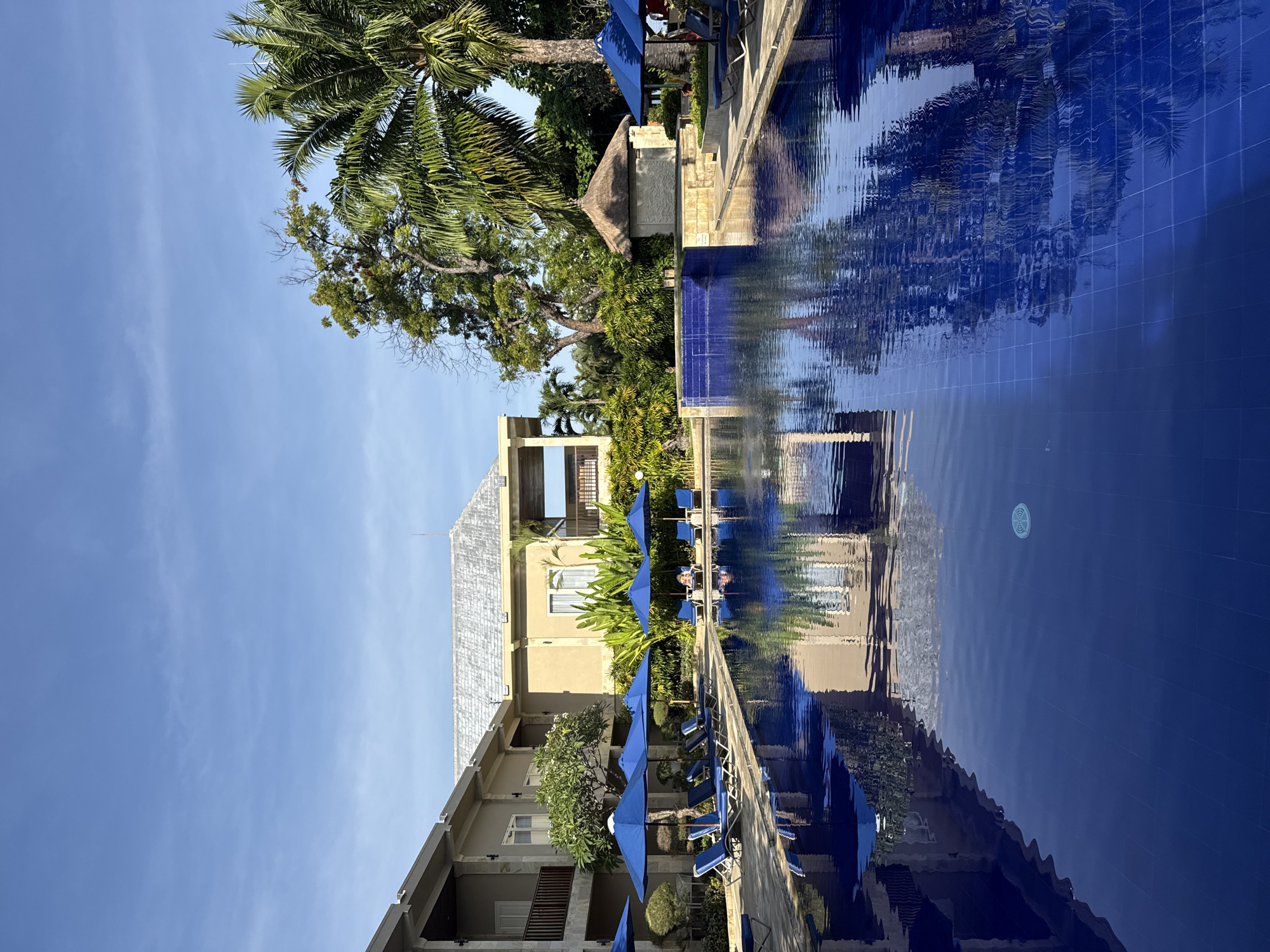 Resort pool and coastal fishing documented in Buleleng, Indonesia