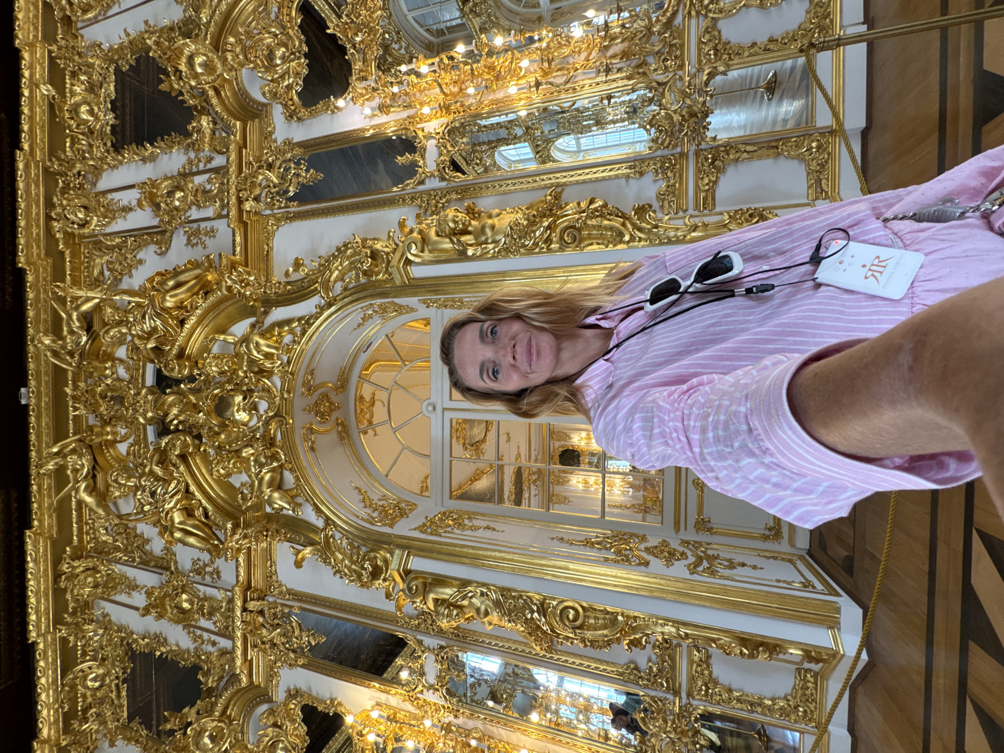 Tourists photograph ornate interiors at Catherine Palace in Russia