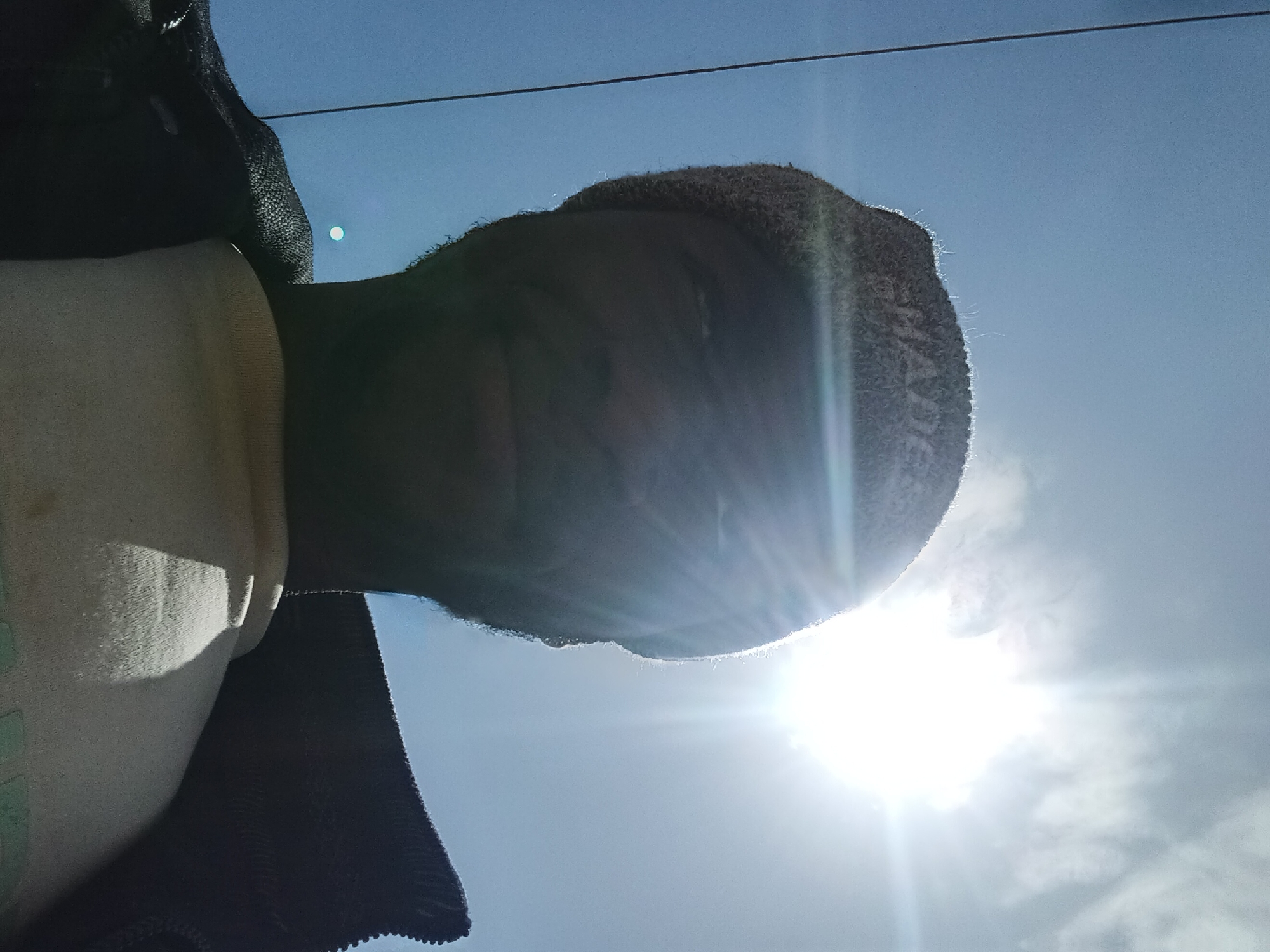 Selfie series in a beanie, street setting, West Africa
