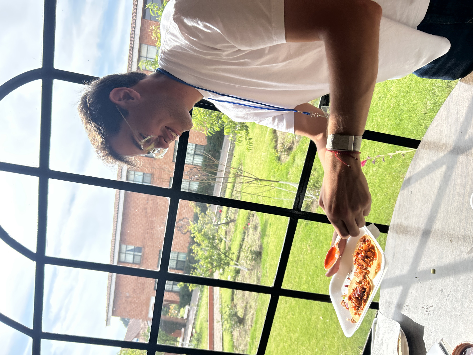 Man with tacos al pastor spotted near ornate brick building