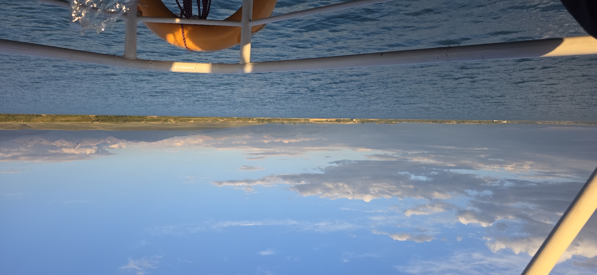 Afternoon boat trip across Issyk-Kul, Kyrgyzstan, into sunset