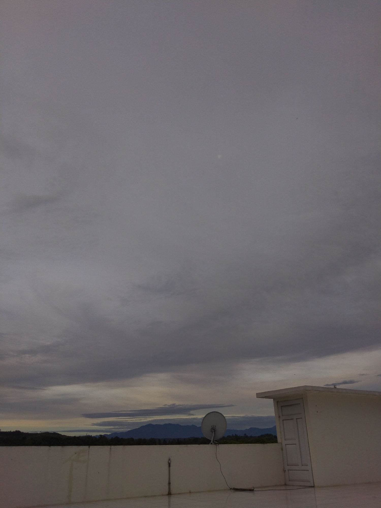 Evening sky observed over Bireuenmeunasahdayah, Indonesia cityscape