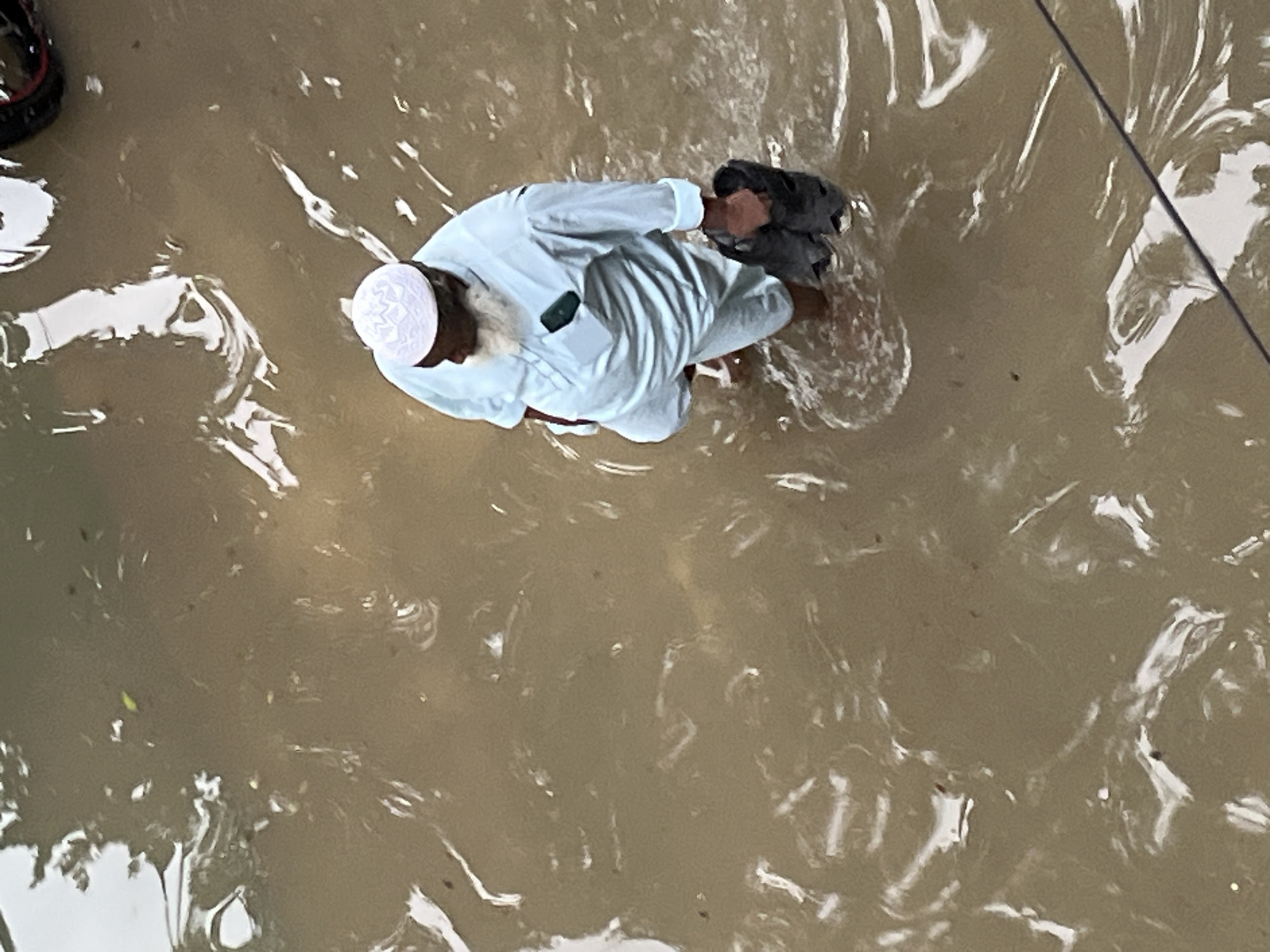 Dhaka neighborhoods flood after heavy rainfall submerges streets and playgrounds