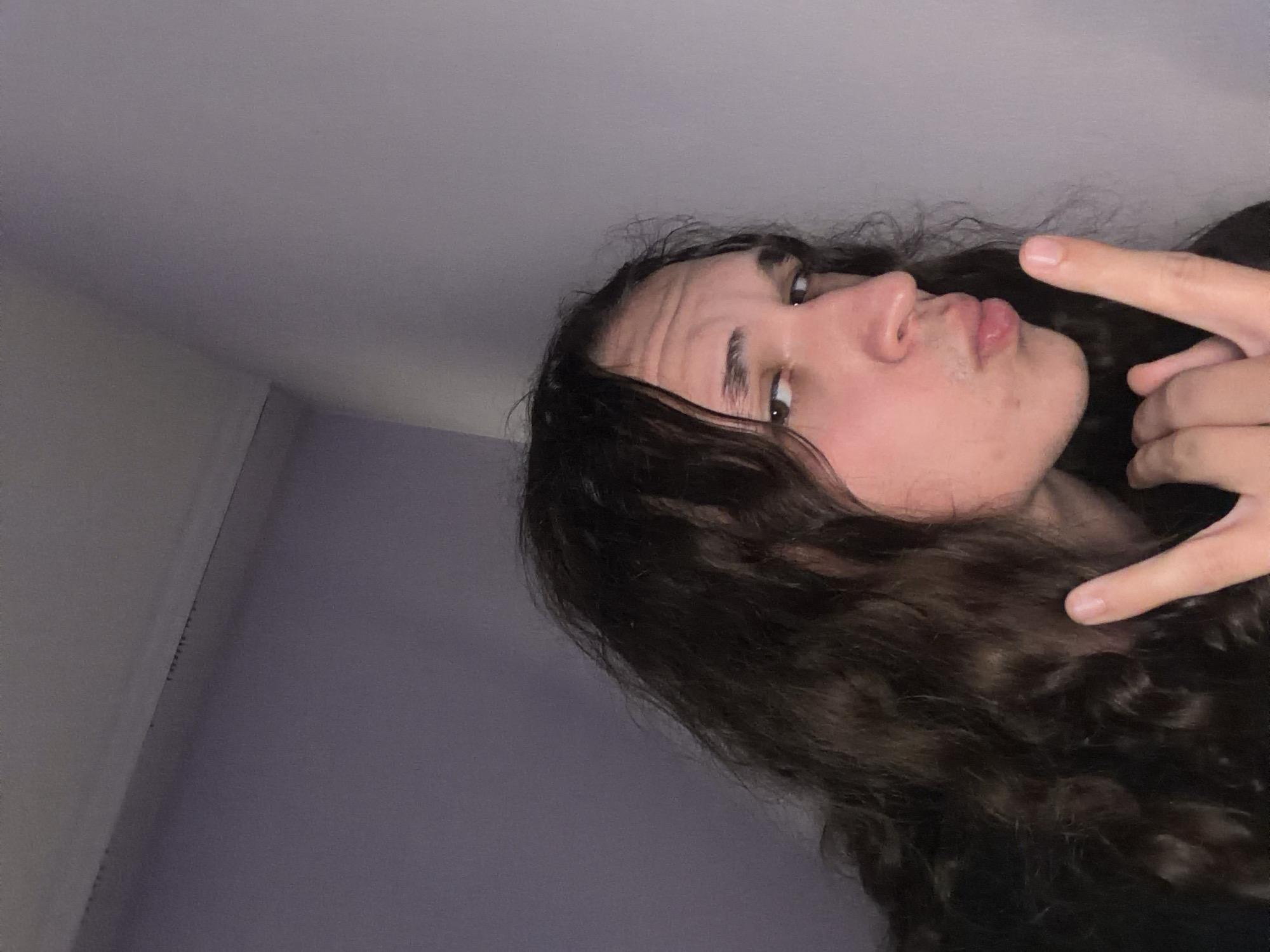 Person takes multiple selfies in bedroom in Bulgaria