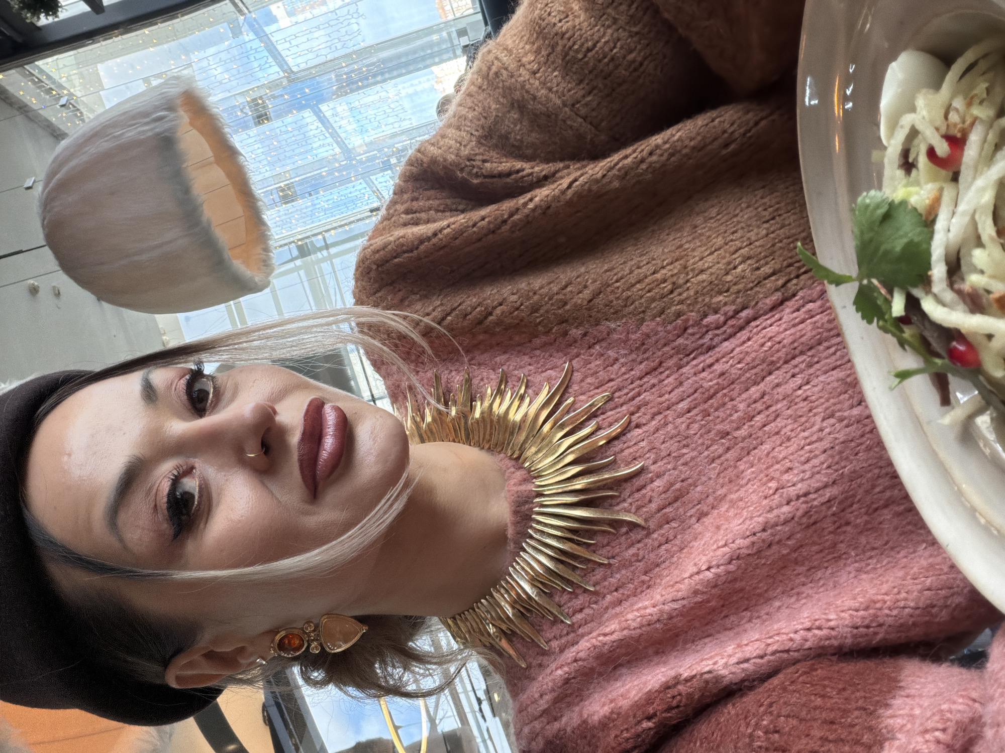 Woman enjoys tea and chocolate dessert at Krasnoyarsk cafe