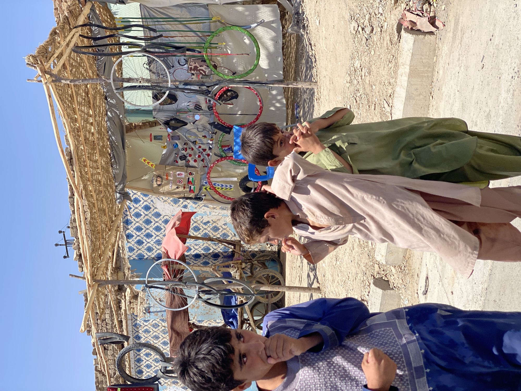Street-level scenes from a Kandahar morning — markets, canals, stalls