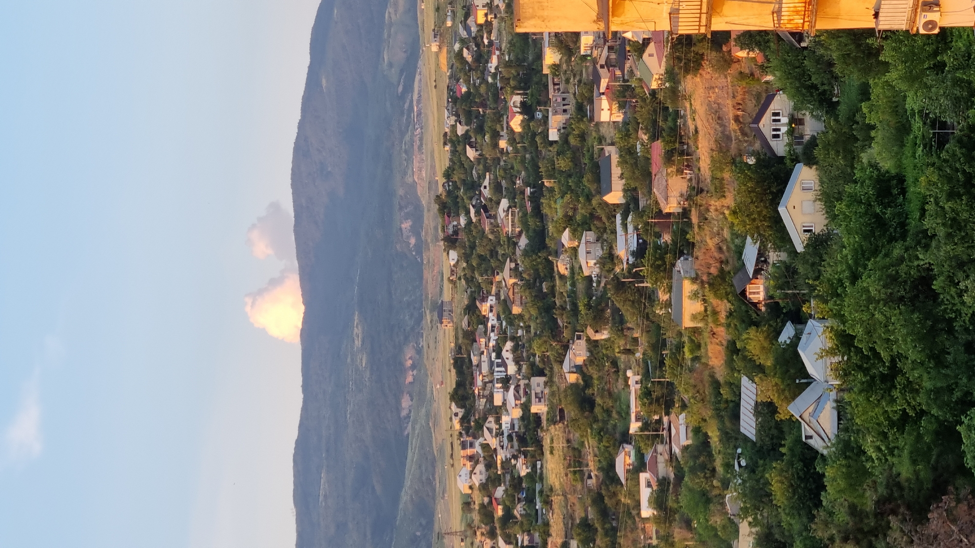 Tbilisi residential neighborhood at golden hour, Soviet blocks and all