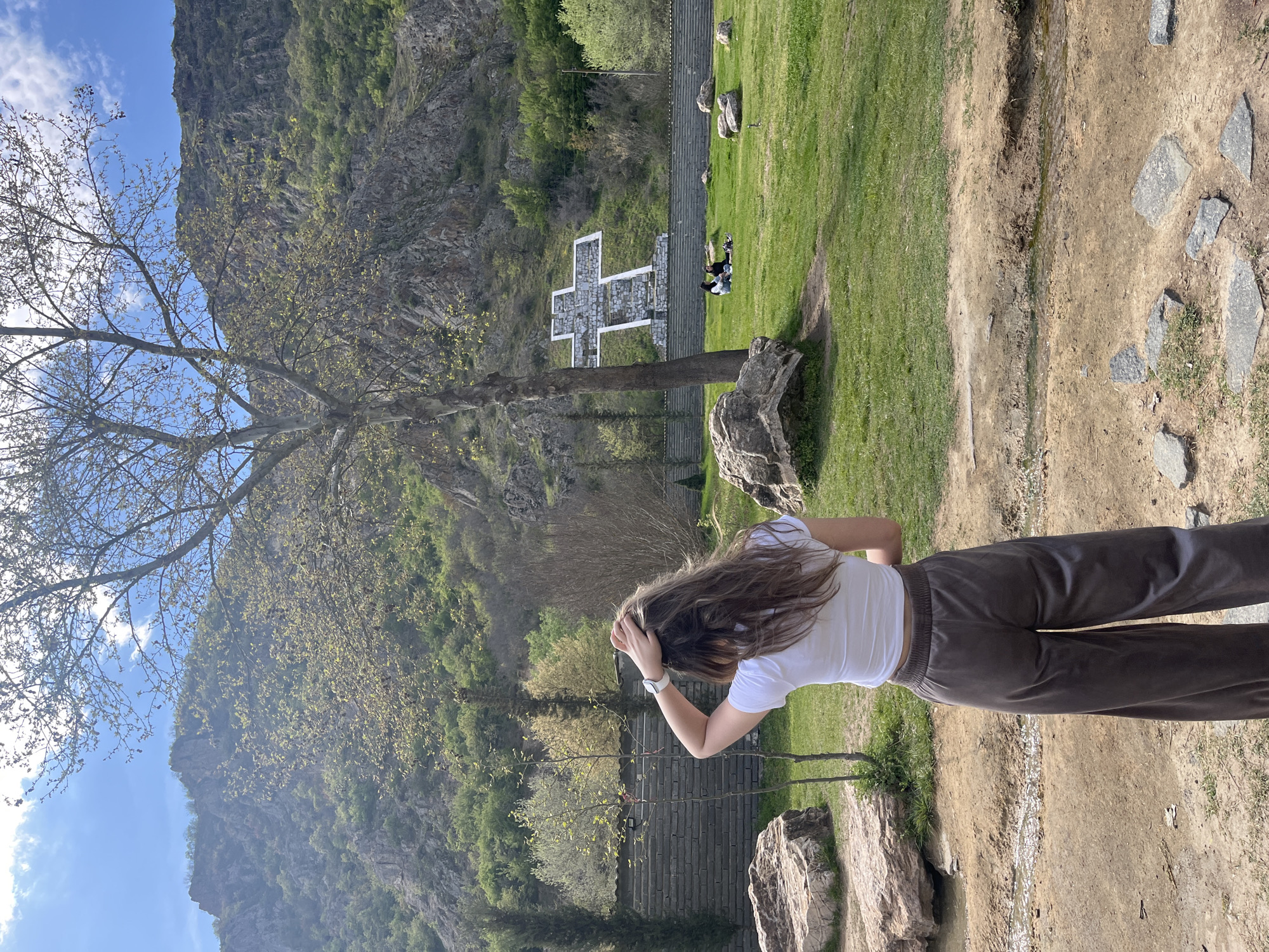 Woman visits turtle pond in Bulgarian village