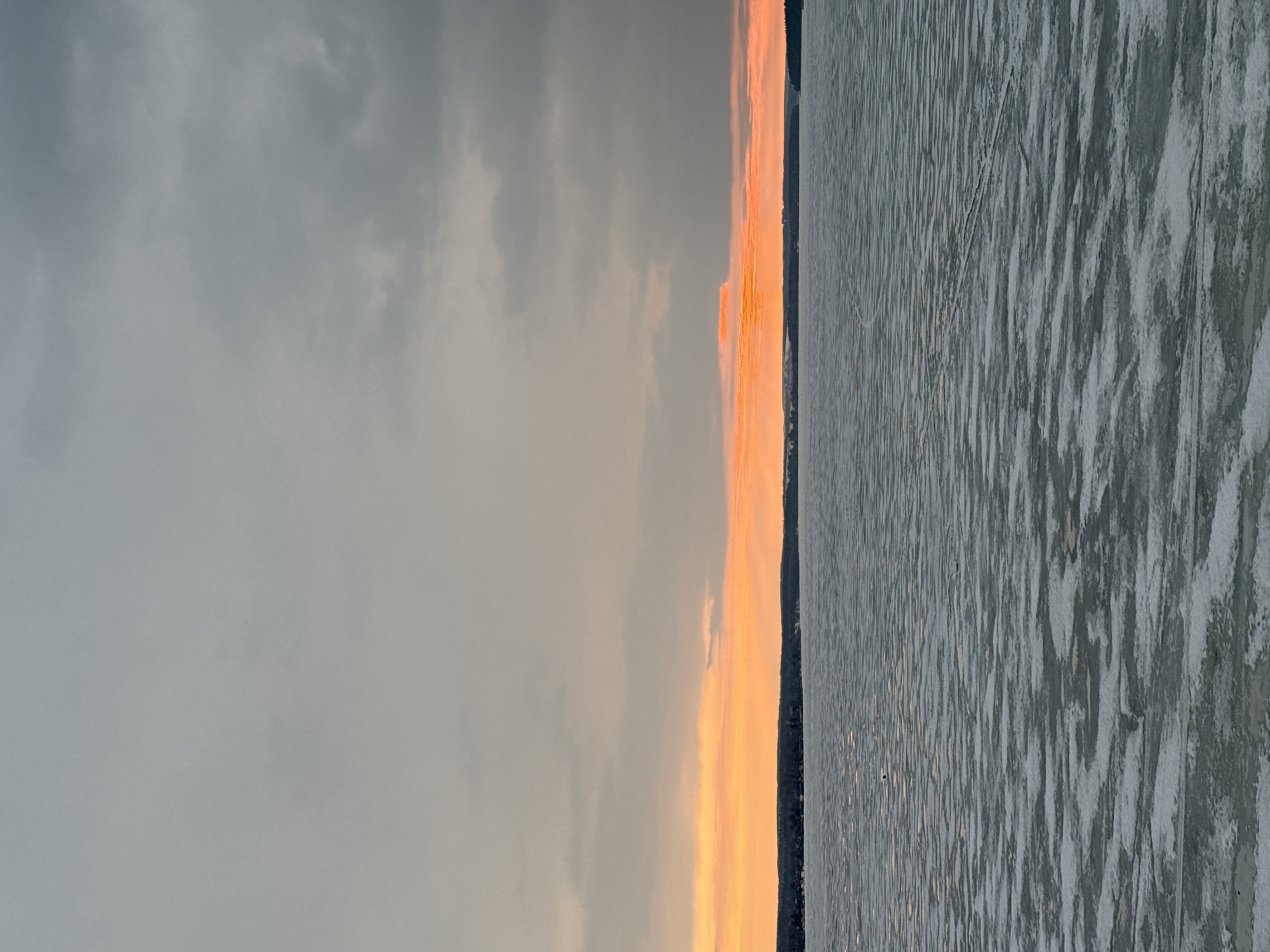 Sunset over frozen water captured in Votkinsk, Russia