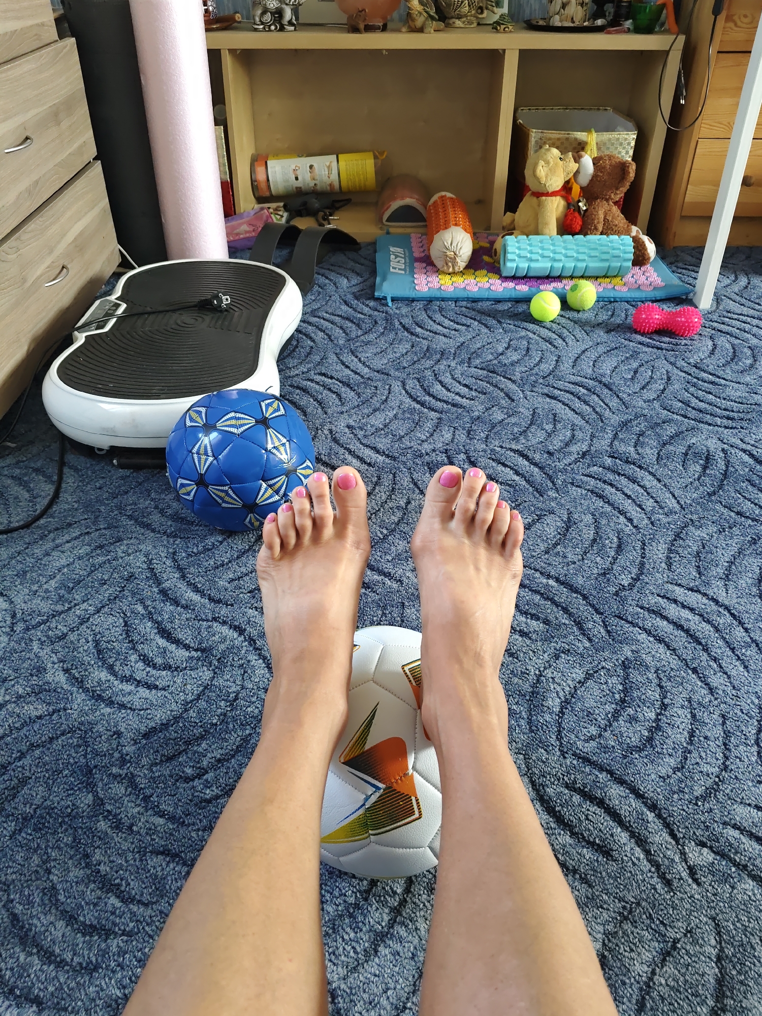 Feet and soccer balls on a blue carpet, Rostov-on-Don