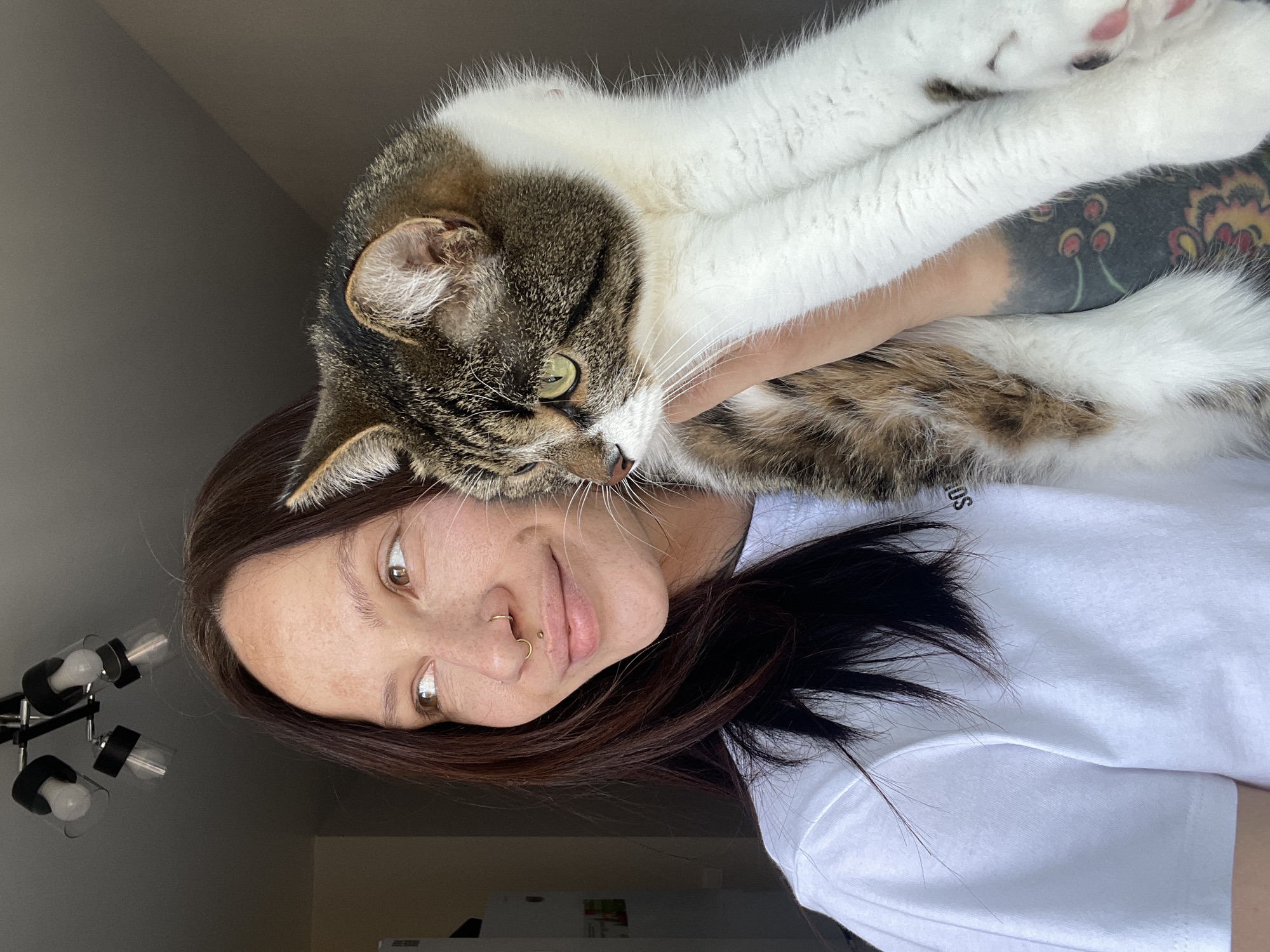 Woman holds cat in Izhevsk home