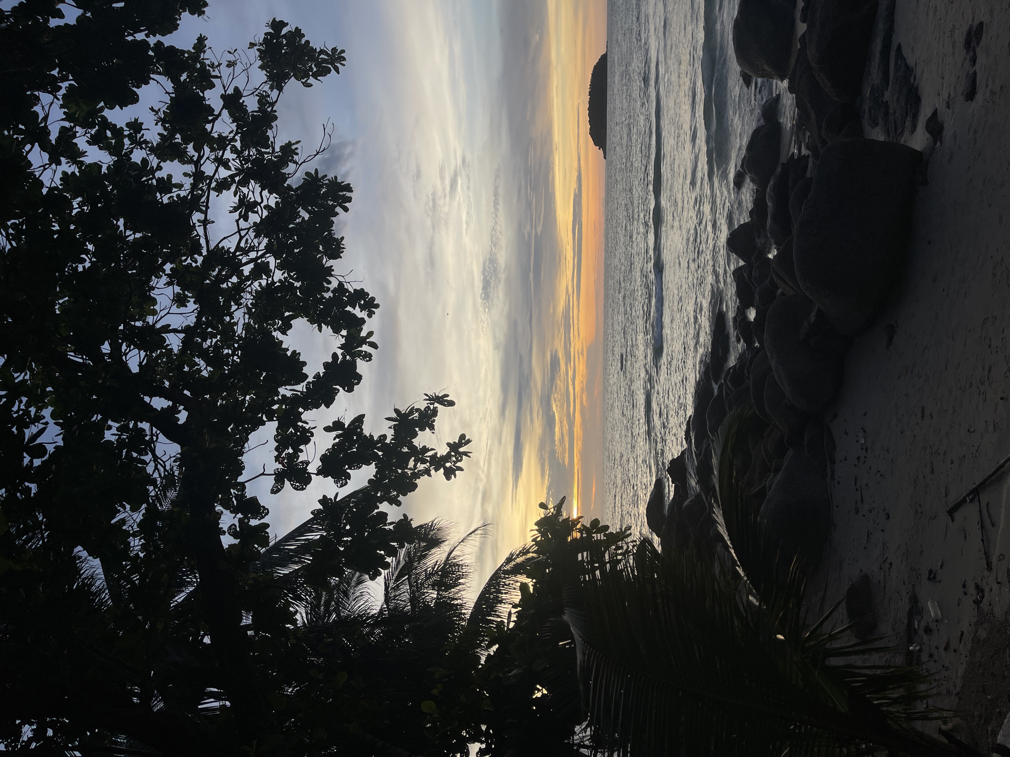 Morning at Karon: beach, surf flags, and resort grounds