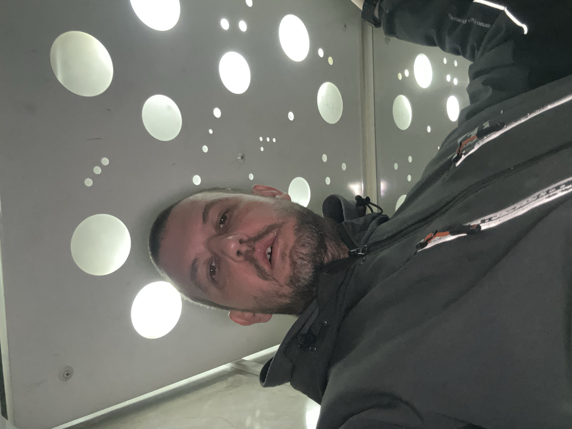 Man photographed against illuminated wall in Sofia