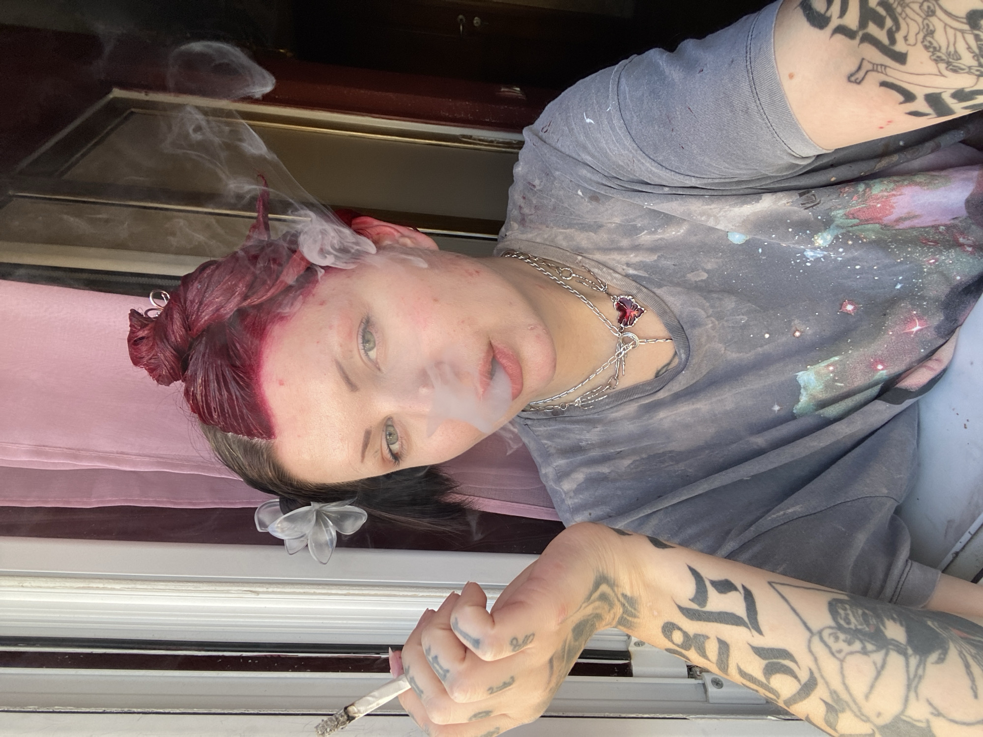 Person with red hair photographed smoking in Kunje, Montenegro