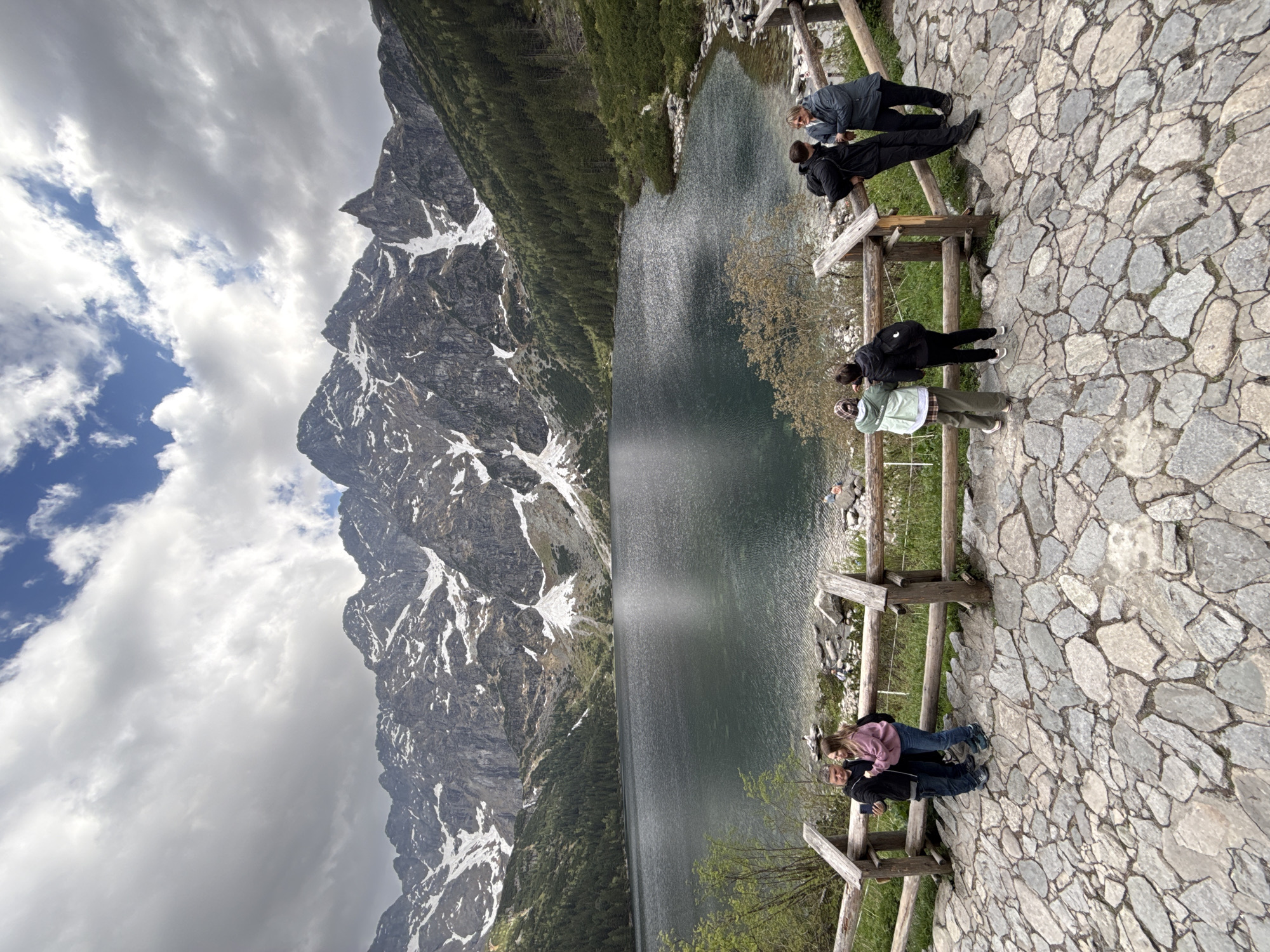 Tourist visits Morskie Oko Lake in Polish Tatra Mountains