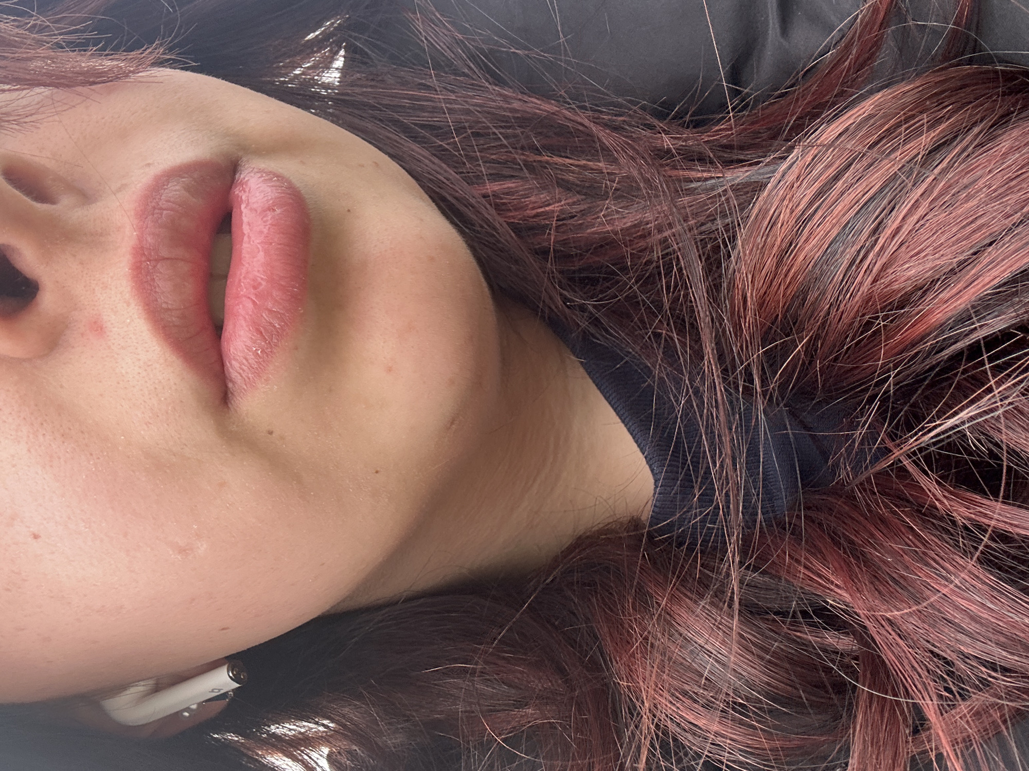 Close-up portrait captured in Sofia shows person with earbuds