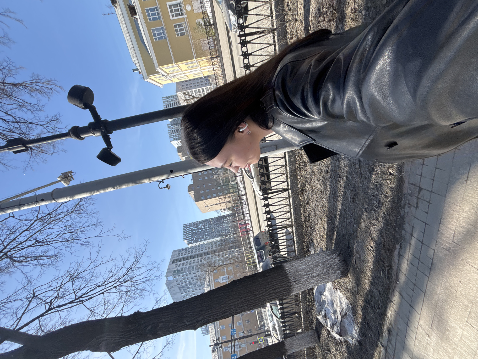 Woman in leather jacket spotted on Perm sidewalk