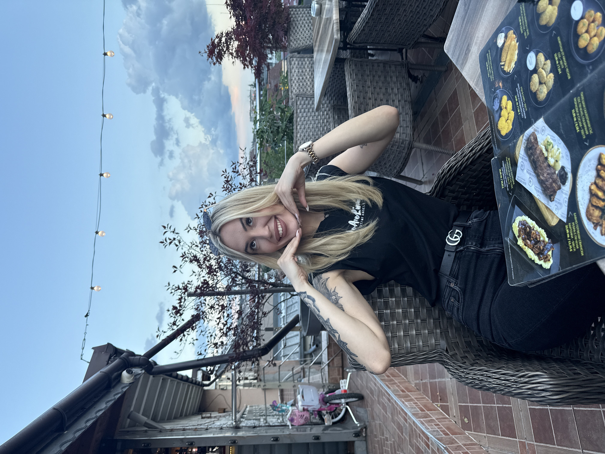 Woman dines outdoors in Ruse during evening hours