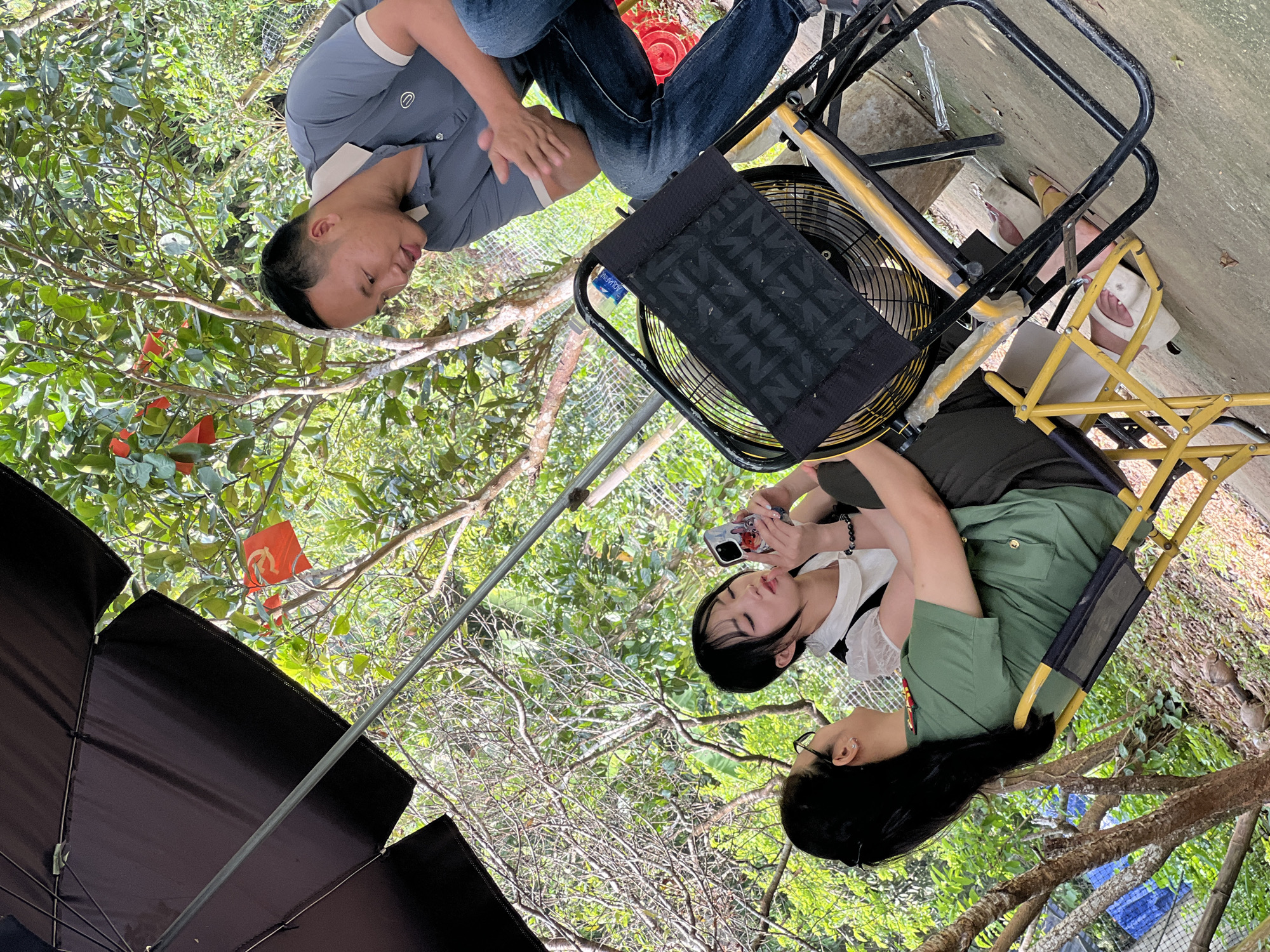 Casual outdoor gathering under the trees in Lai Đồng
