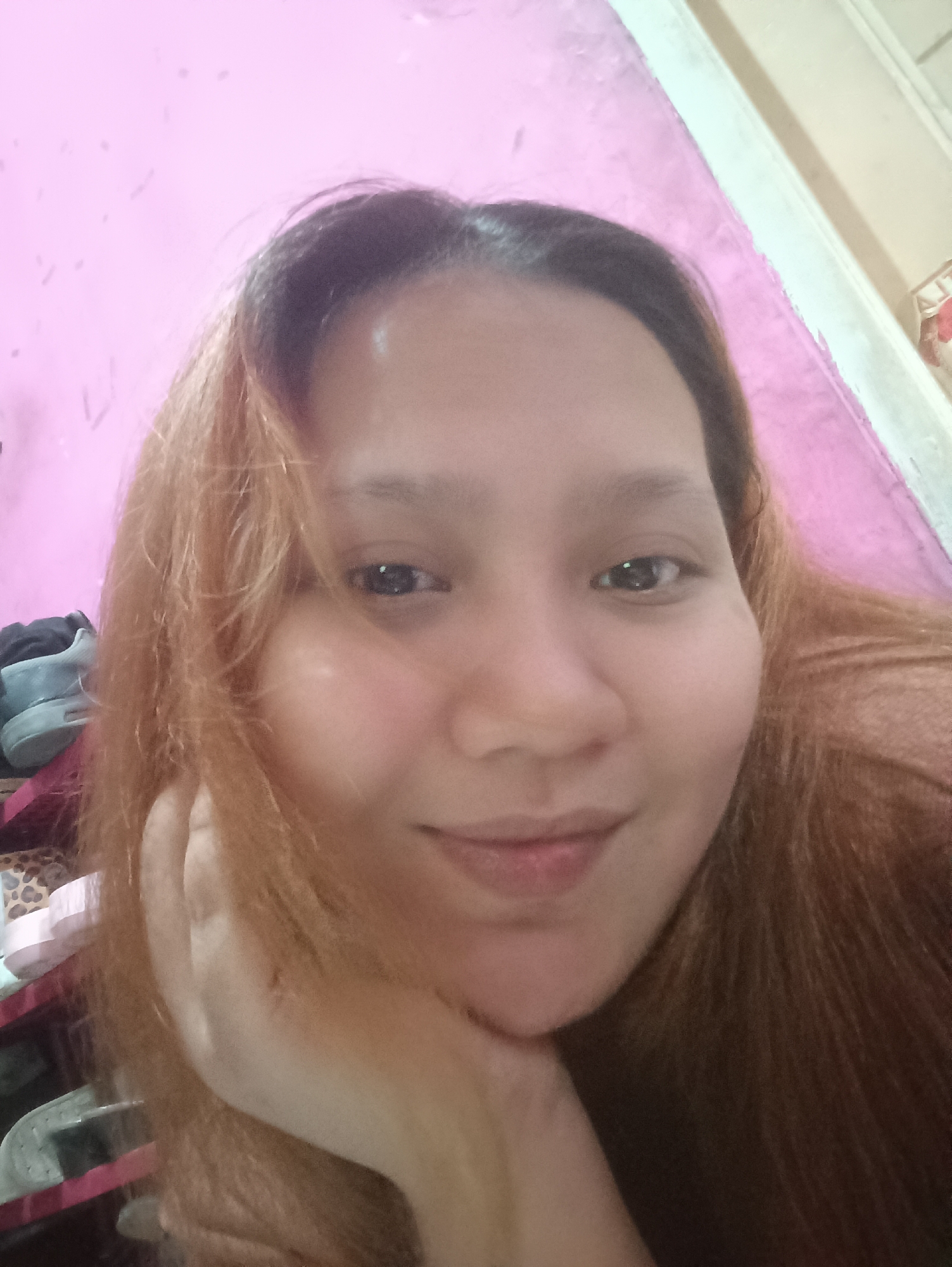 Selfie session at a pink-walled Depok home, July 2026