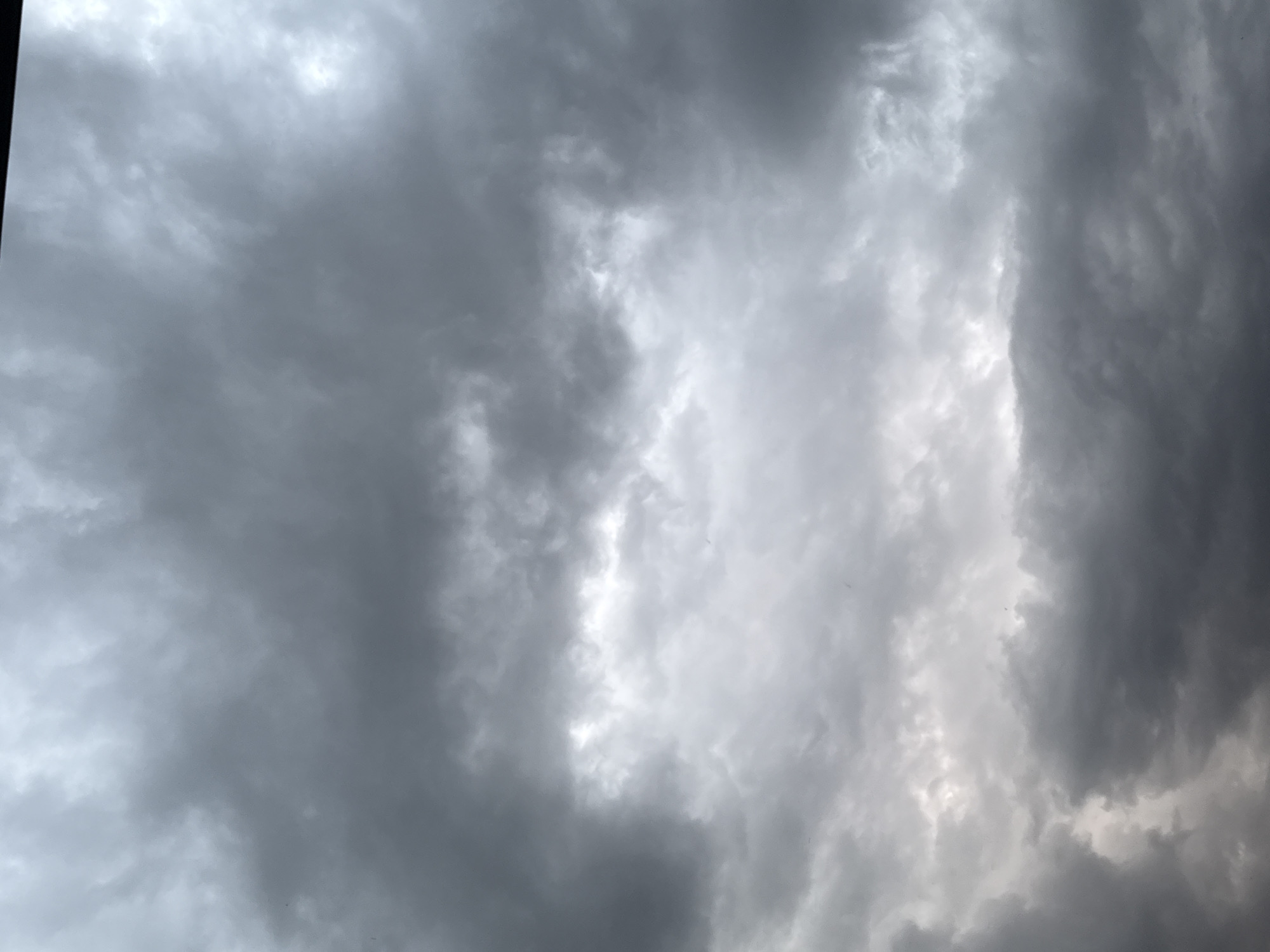 Storm clouds gather over residential area Thursday evening
