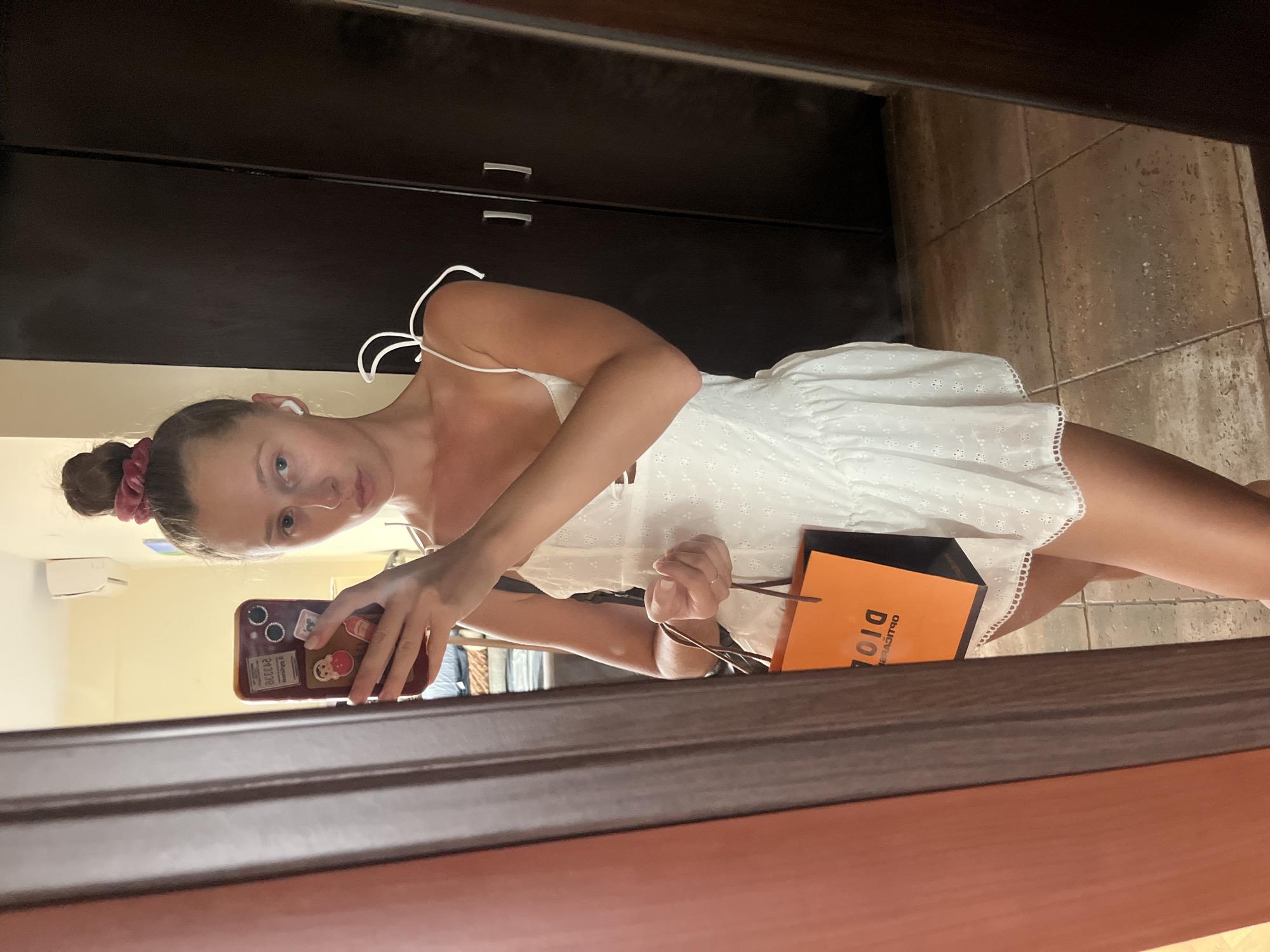 White dress, Dior bag, mirror selfie to street shot