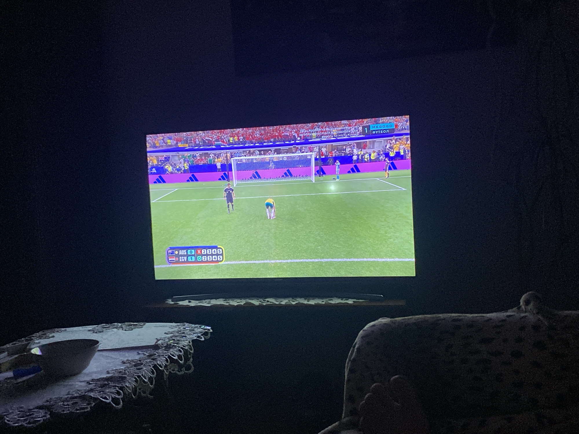 Soccer match watched on TV in Zastavna on a summer evening