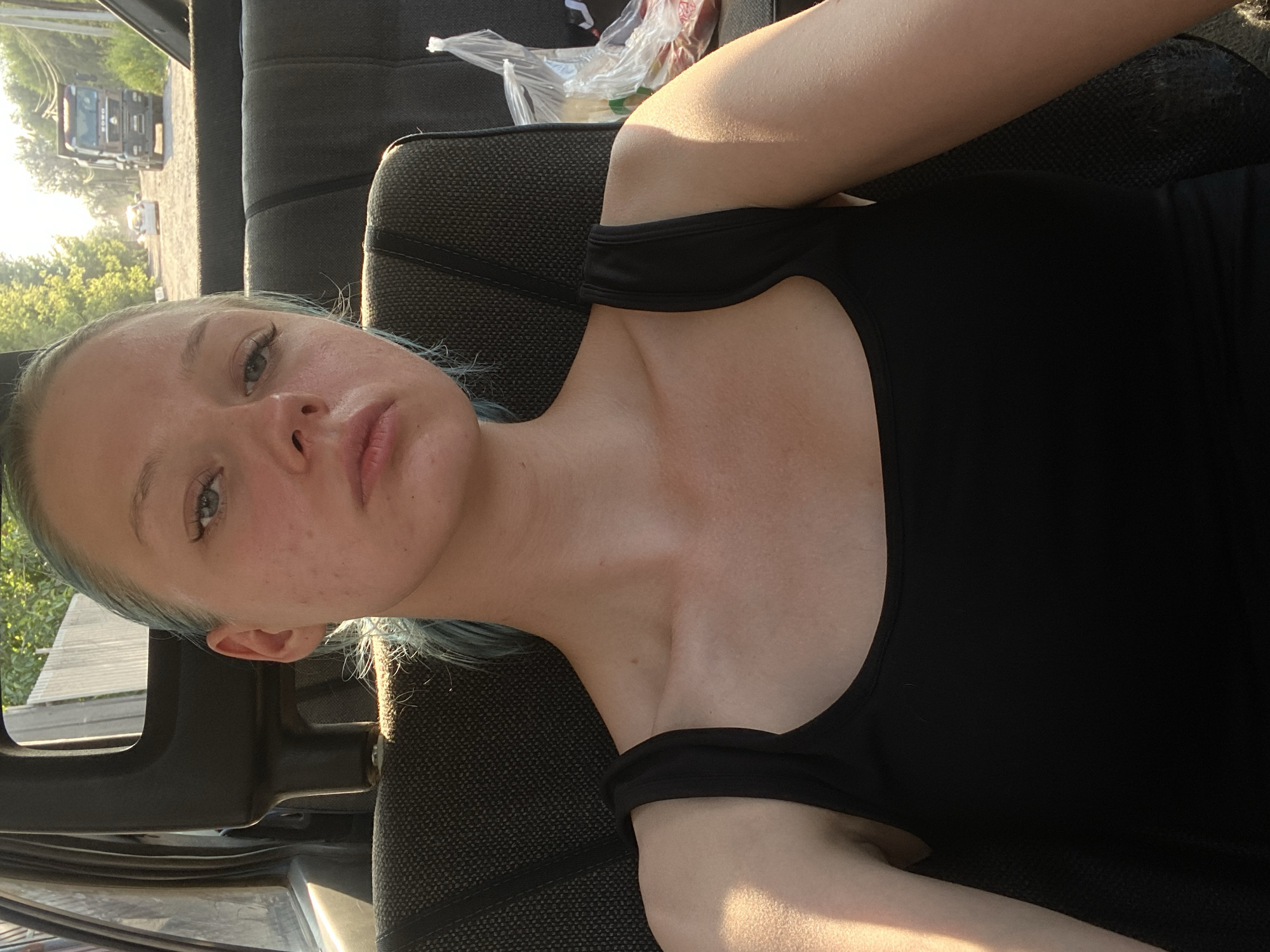 Chilling in a parked vehicle on a sunny Bishkek afternoon