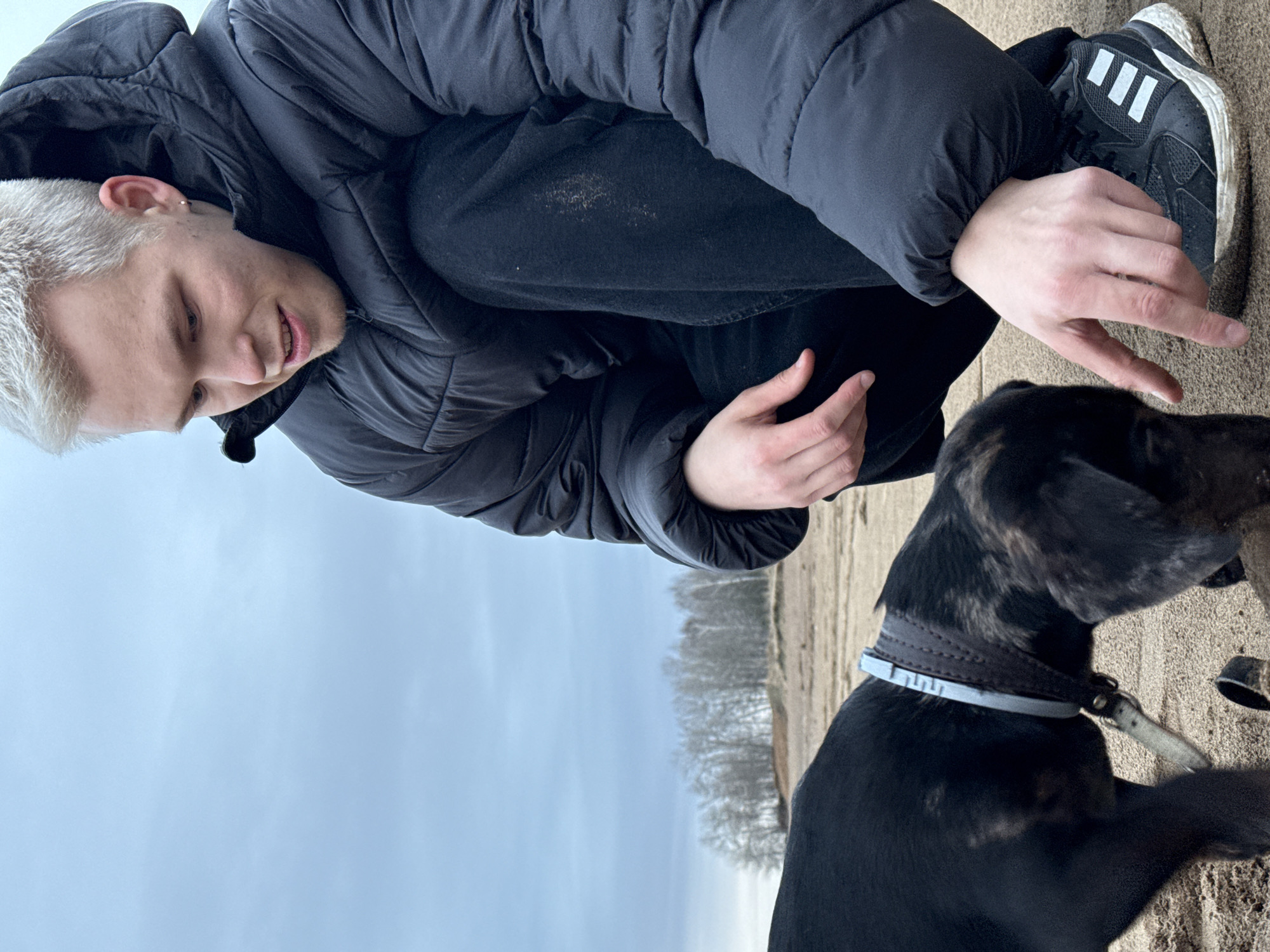 Man reaches out to dog in Chaikovsky, Russia