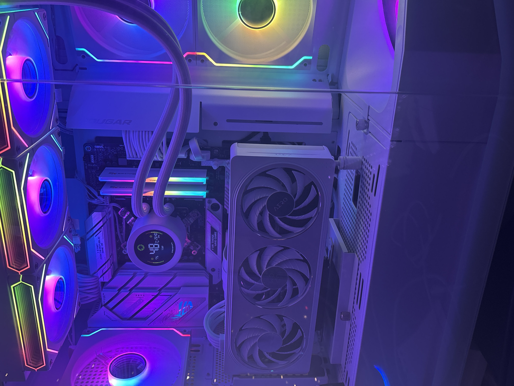 RGB-heavy white PC build and peripherals shot from multiple angles