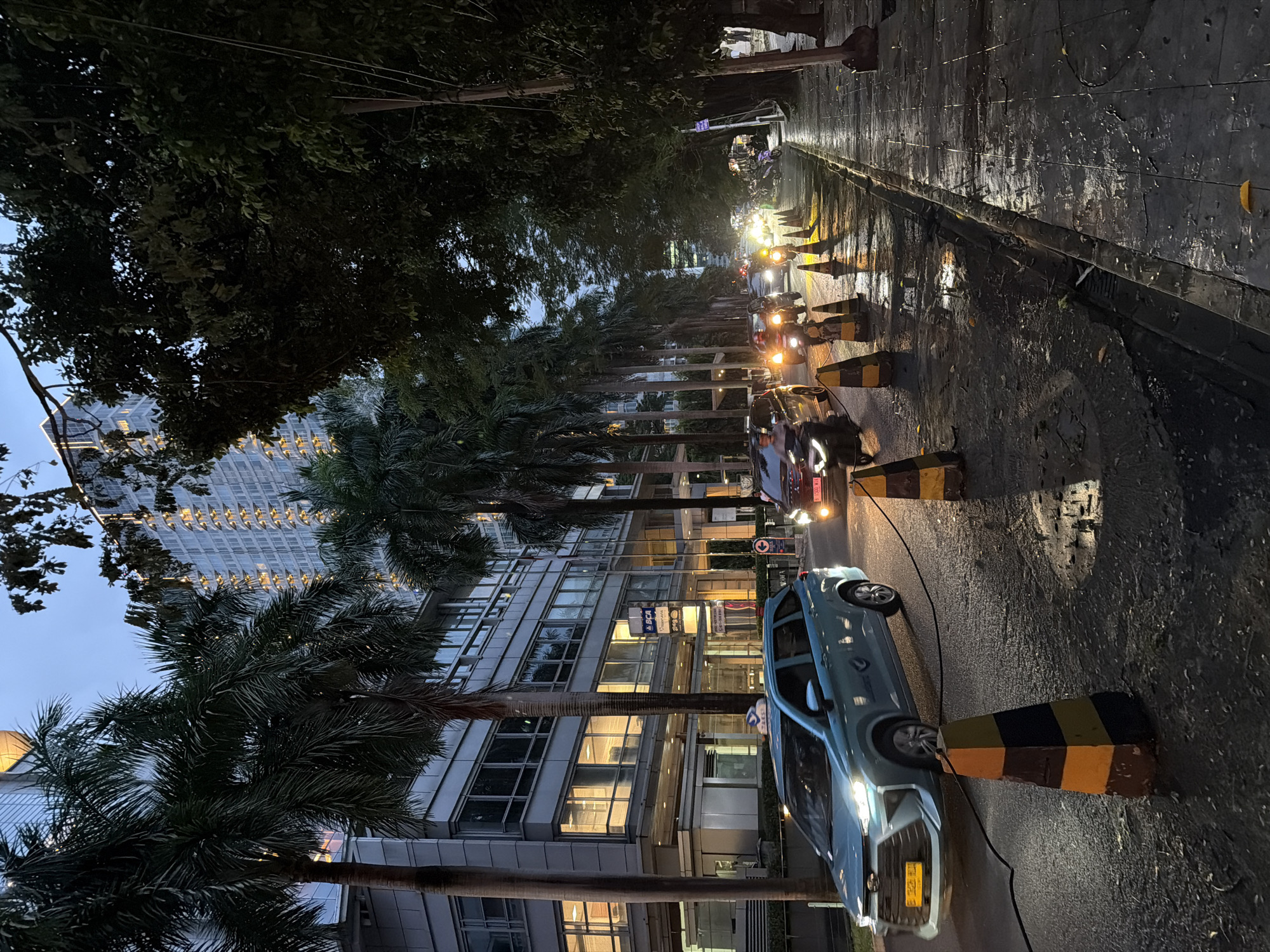 Wet street scene captured in South Jakarta commercial district
